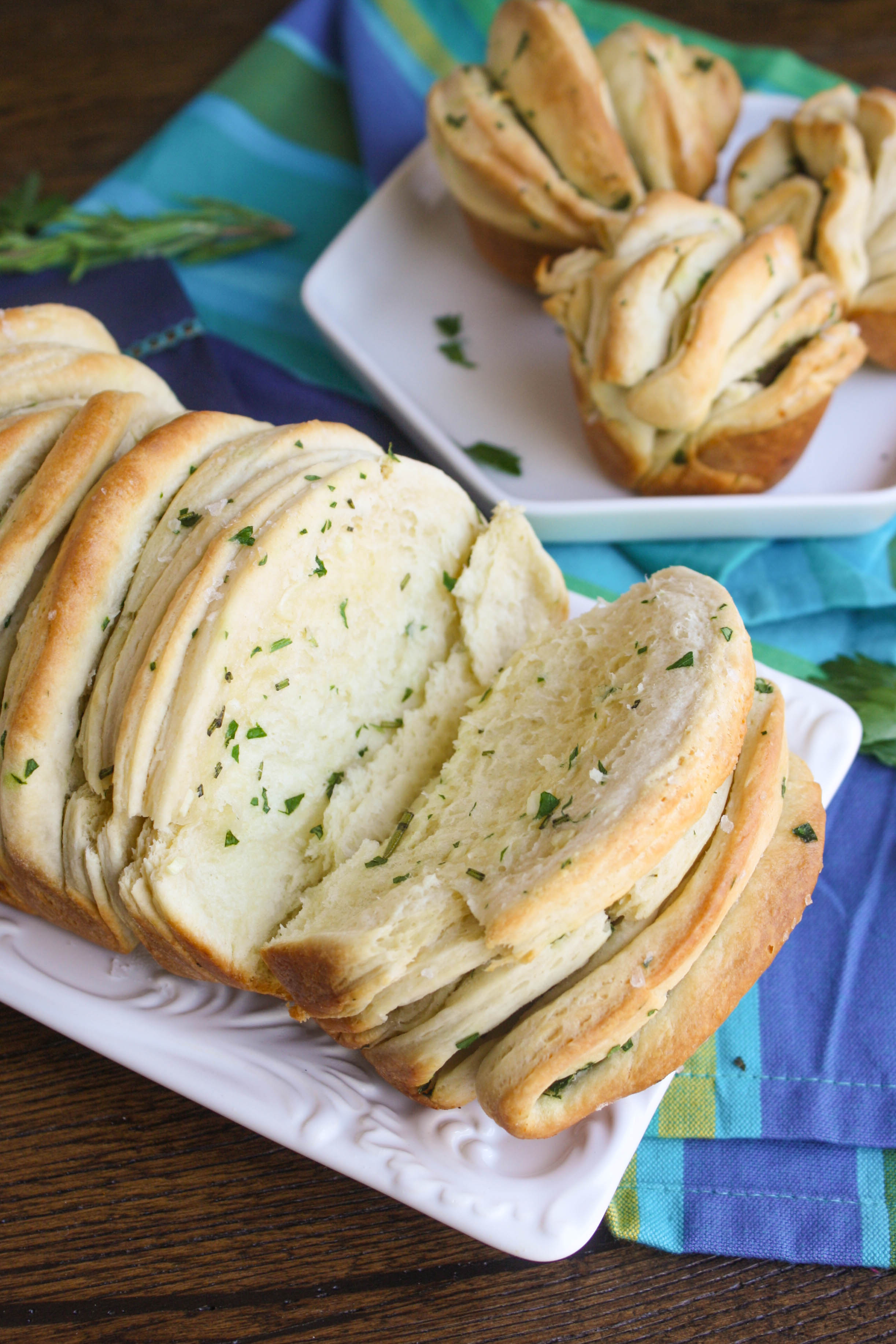 Garlic & Herb Pull Apart Bread is fluffy and fun! The flavors are amazing and you'll love how it's served.
