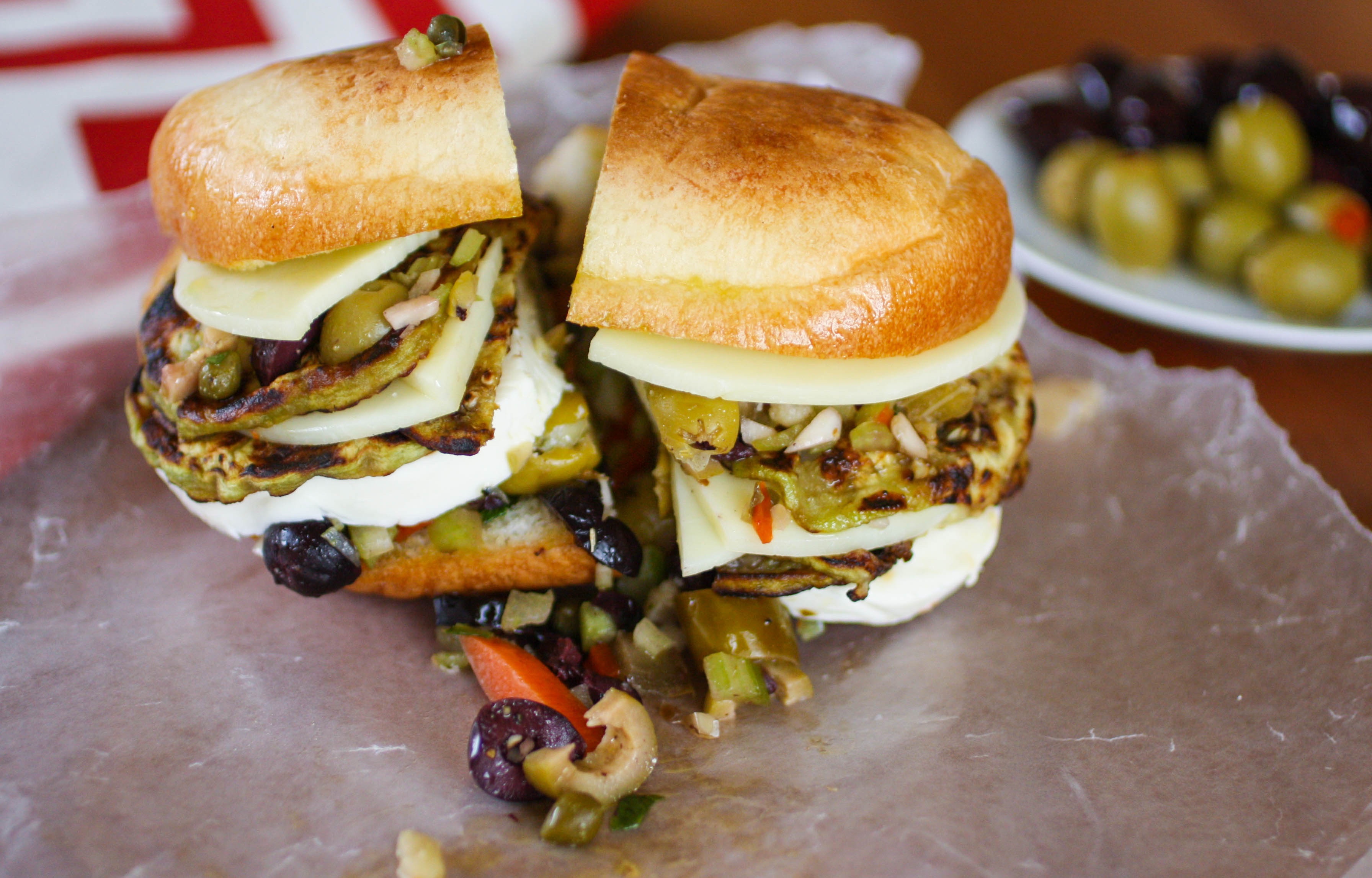Eggplant Muffuletta Sandwiches are delicious and are a tasty vegetarian take on the classic. You'll love these Eggplant Muffuletta Sandwiches for their big flavor -- what a great vegetarian option!