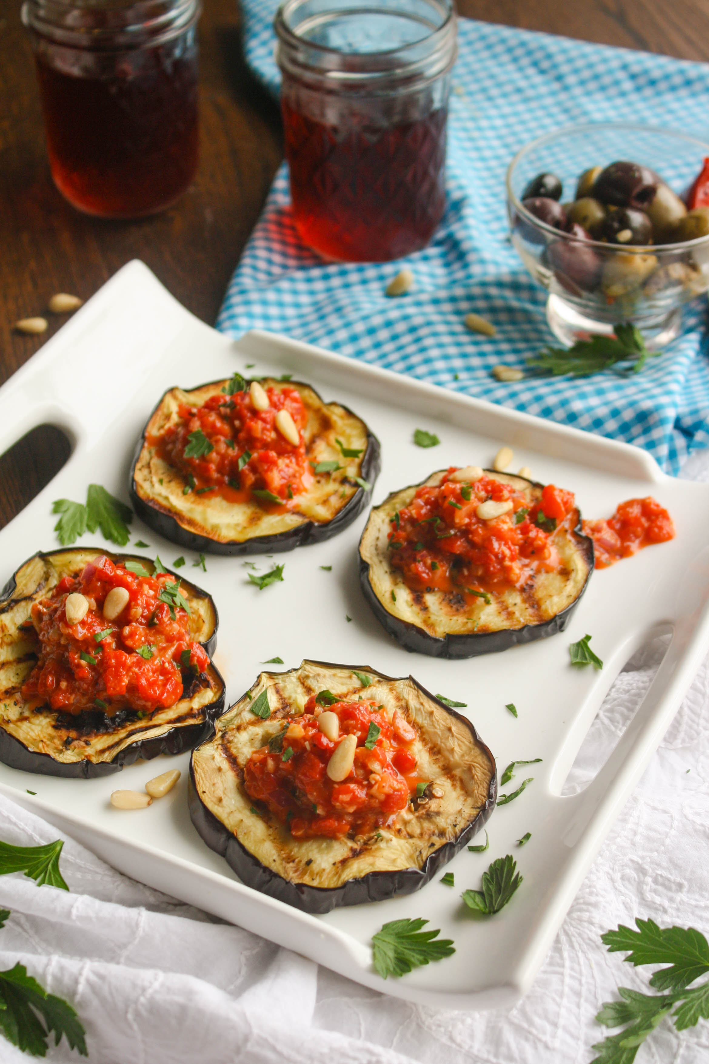 Grilled Eggplant with Roasted Red Pepper Tapenade is a summer seasonal dish that is perfect for any occasion. It's easy to make and full of flavor!