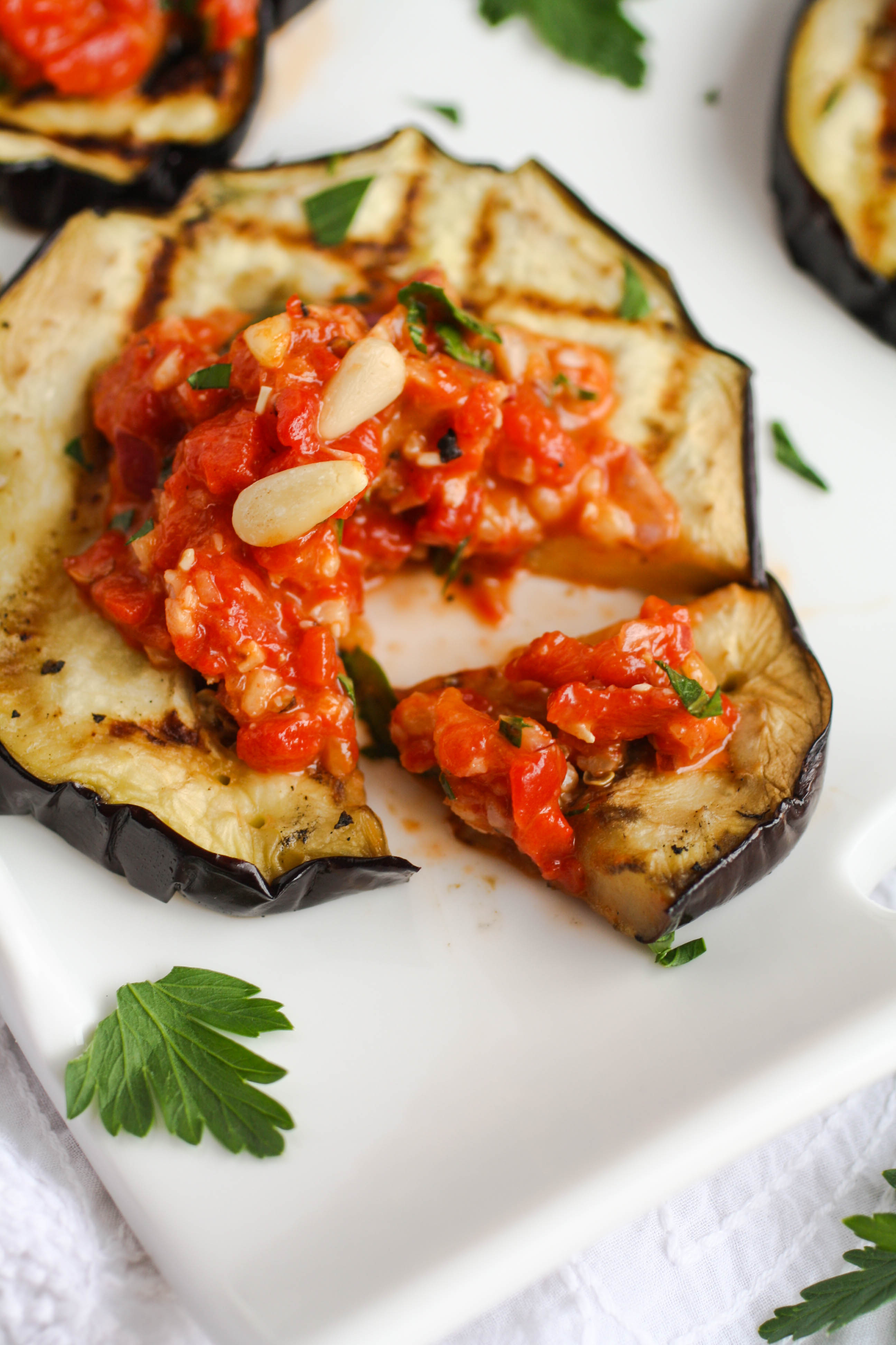 Grilled Eggplant with Roasted Red Pepper Tapenade is a fabulous summer dish. It's easy to make on the grill for a wonderful meal.