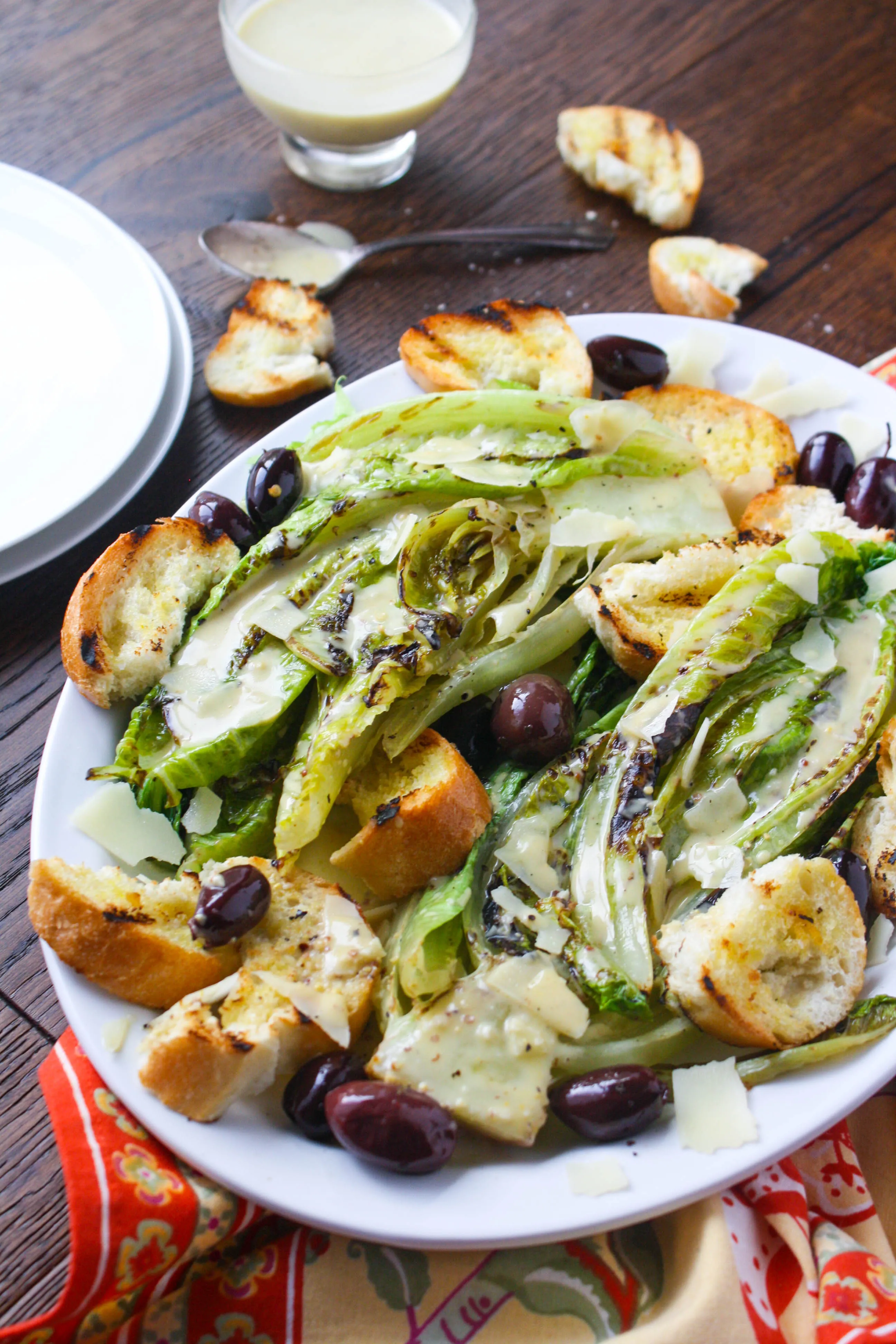Grilled Romaine Salad with Caesar Dressing is a fun salad to serve any time of year. You'll love its flavor.