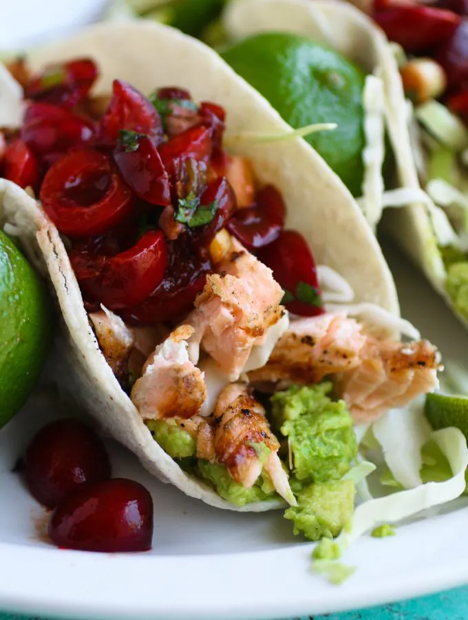 Grilled Salmon Tacos with Fresh Cherry-Chipotle Salsa is perfect for Taco Tuesday or any other day! You'll love the salmon with the zingy salsa, perfect for grilling season.