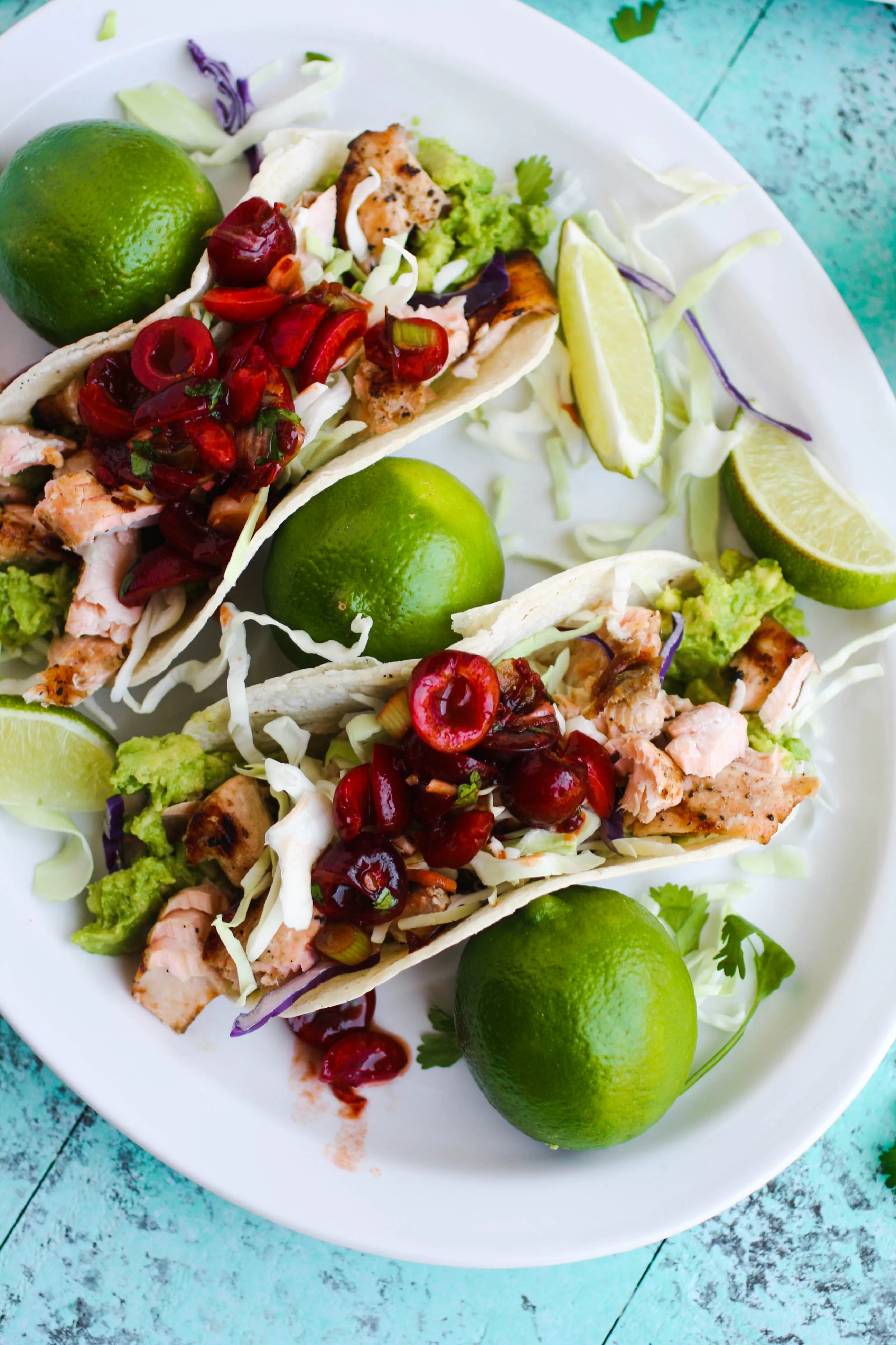 Grilled Salmon Tacos with Cherry-Chipotle Salsa is an amazing summer dish. You'll love everything from the salmon down to the fresh salsa!