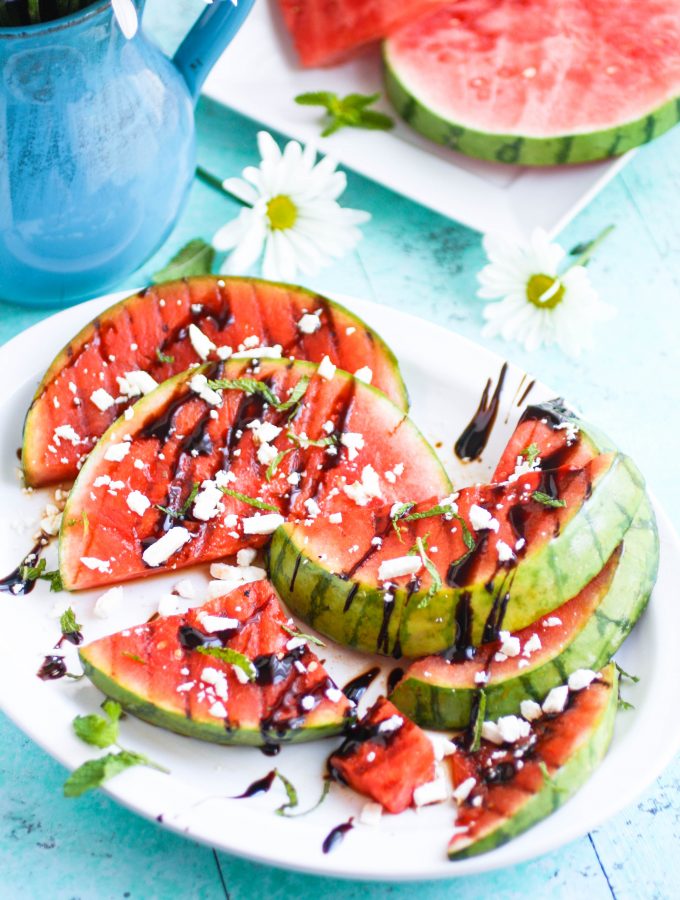 Grilled Watermelon with Feta, Mint, and Balsamic Glaze makes a fresh and fruity appetizer. Grilled Watermelon with Feta, Mint, and Balsamic Glaze is a fun appetizer to make this summer.
