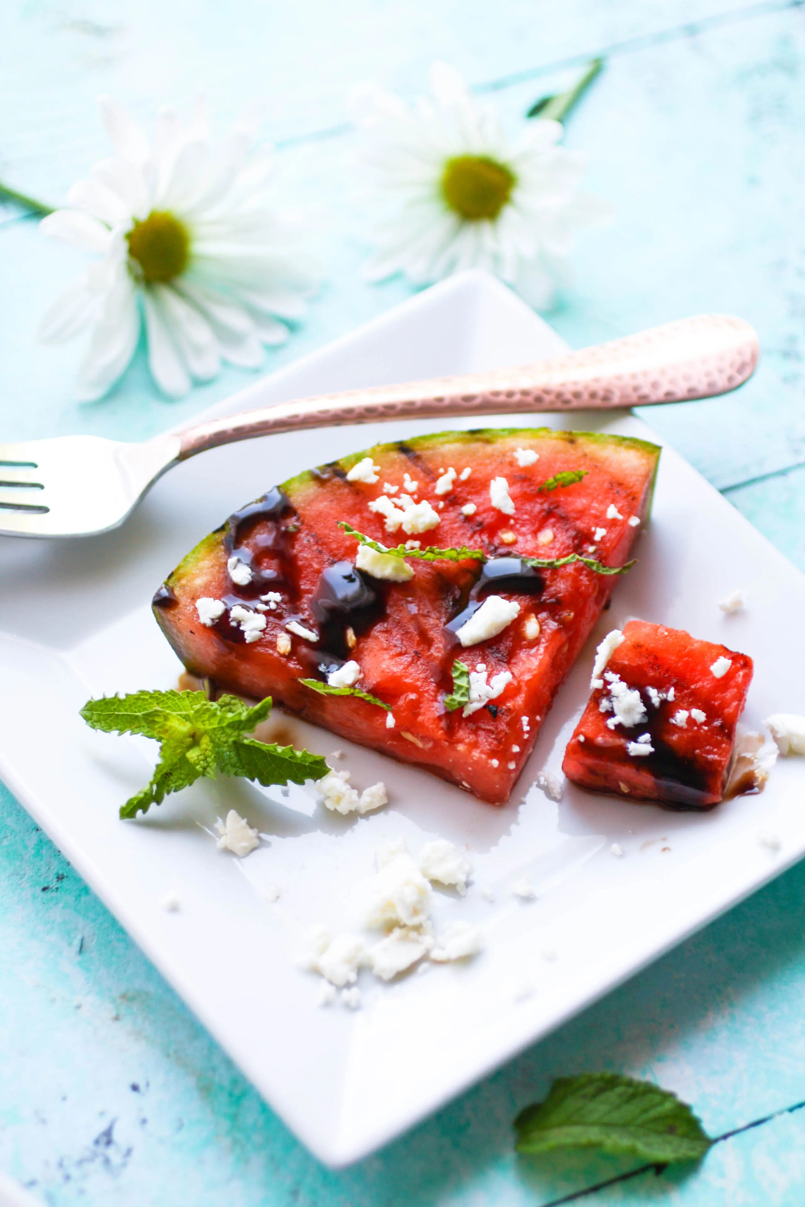 Grilled Watermelon with Feta, Mint, and Balsamic Glaze is a fresh and fun appetizer for the season. Grilled Watermelon with Feta, Mint, and Balsamic Glaze is an easy to make appetizer perfect for summer!
