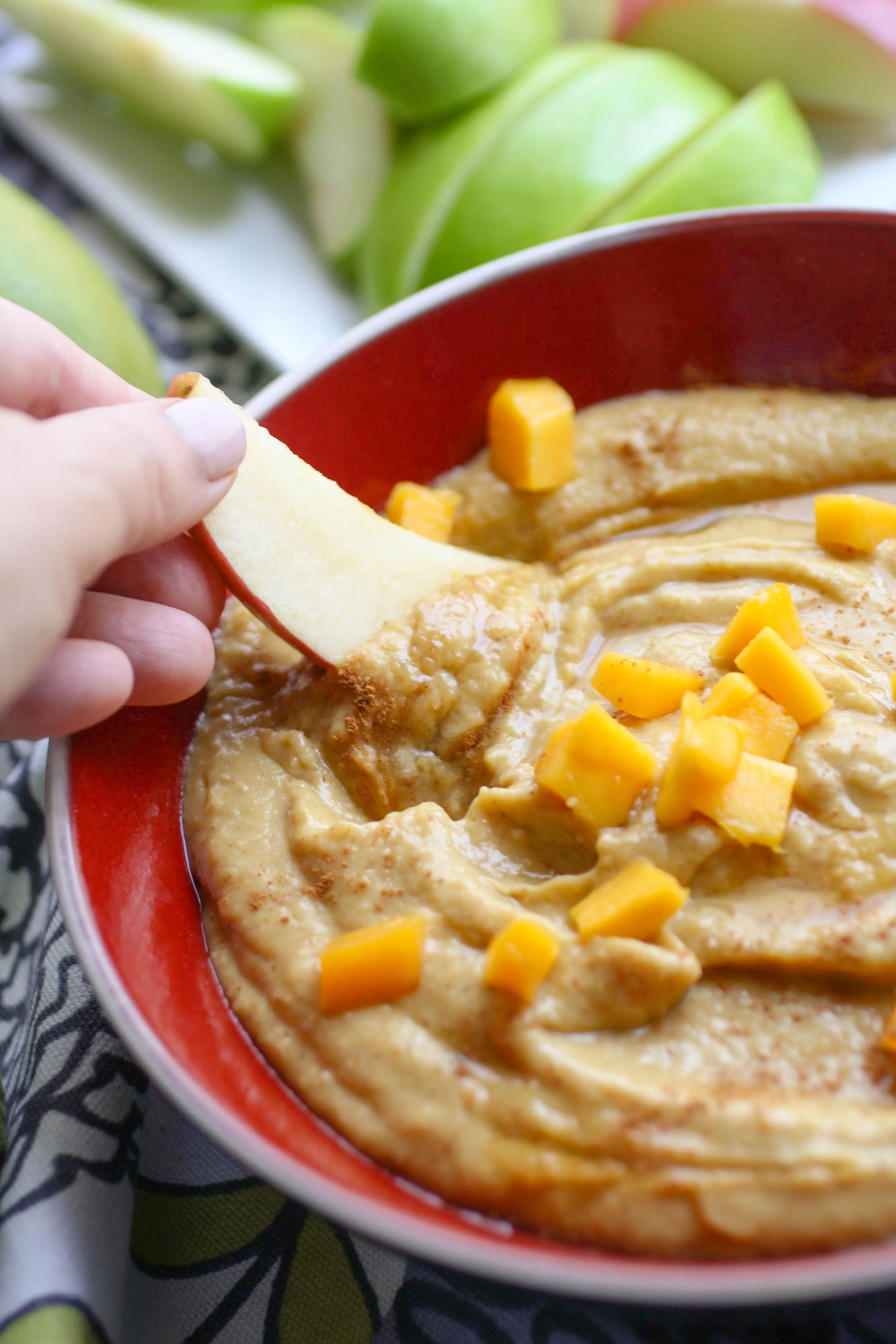Honey-Mango Dessert Hummus is perfect as a snack or dessert. Toast up some pita chips sprinkled with a touch of sugar, and slice up some apples and you're set!