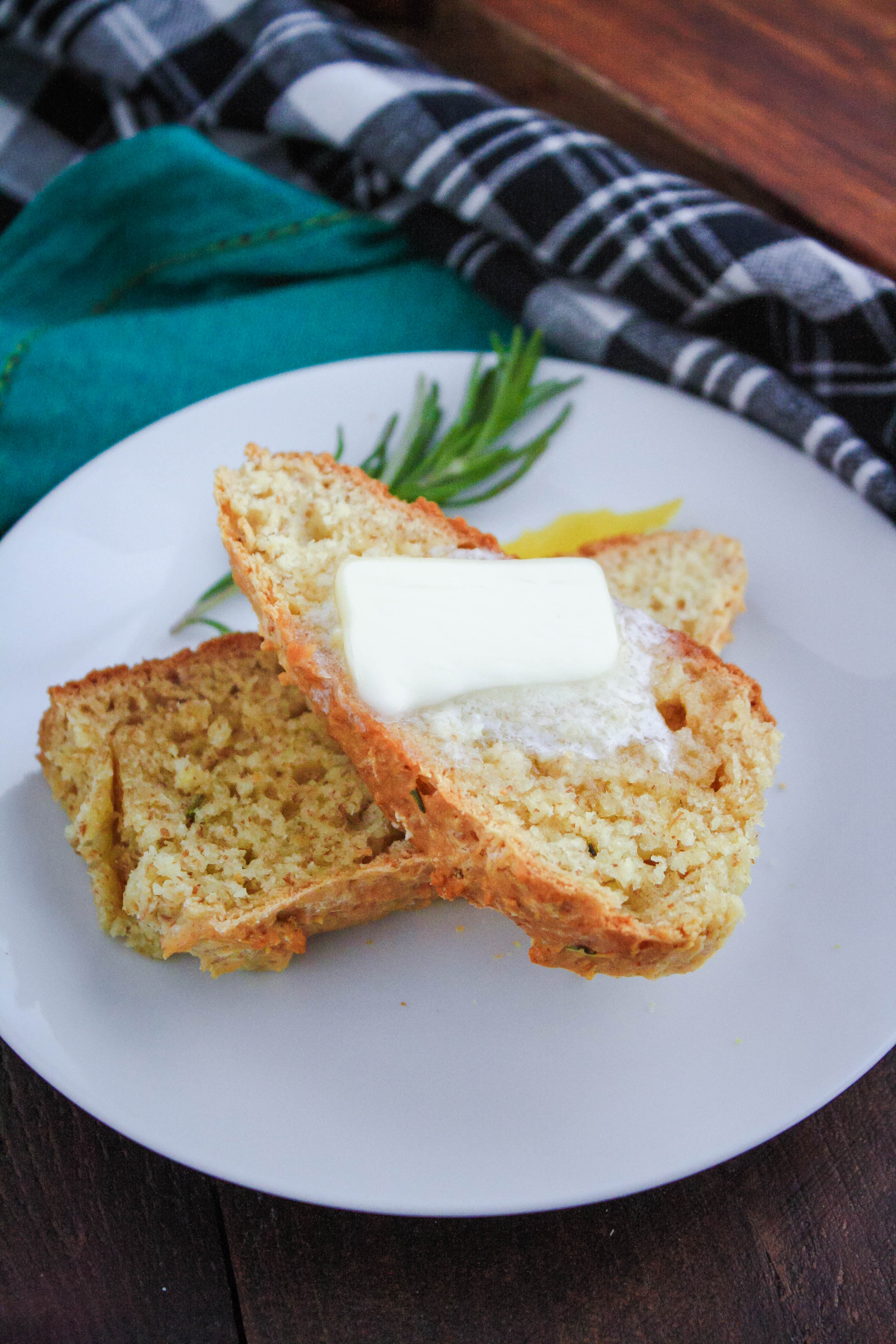 Irish Soda Bread with Rosemary & Lemon slices up so nicely and tastes amazing with a pat of butter. Irish Soda Bread with Rosemary & Lemon is a flavorful quick bread you'll love.