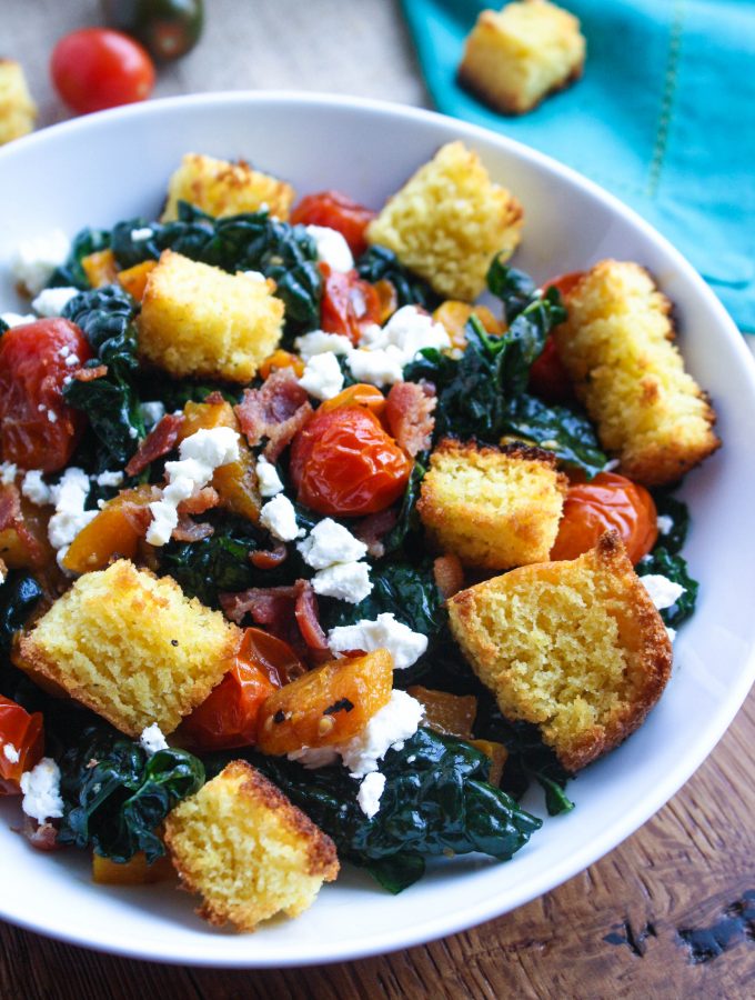 Kale and Cornbread Crouton Salad is a welcome dish the day after Thanksgiving. Use some leftovers to make the cornbread croutons for this wonderful kale salad!