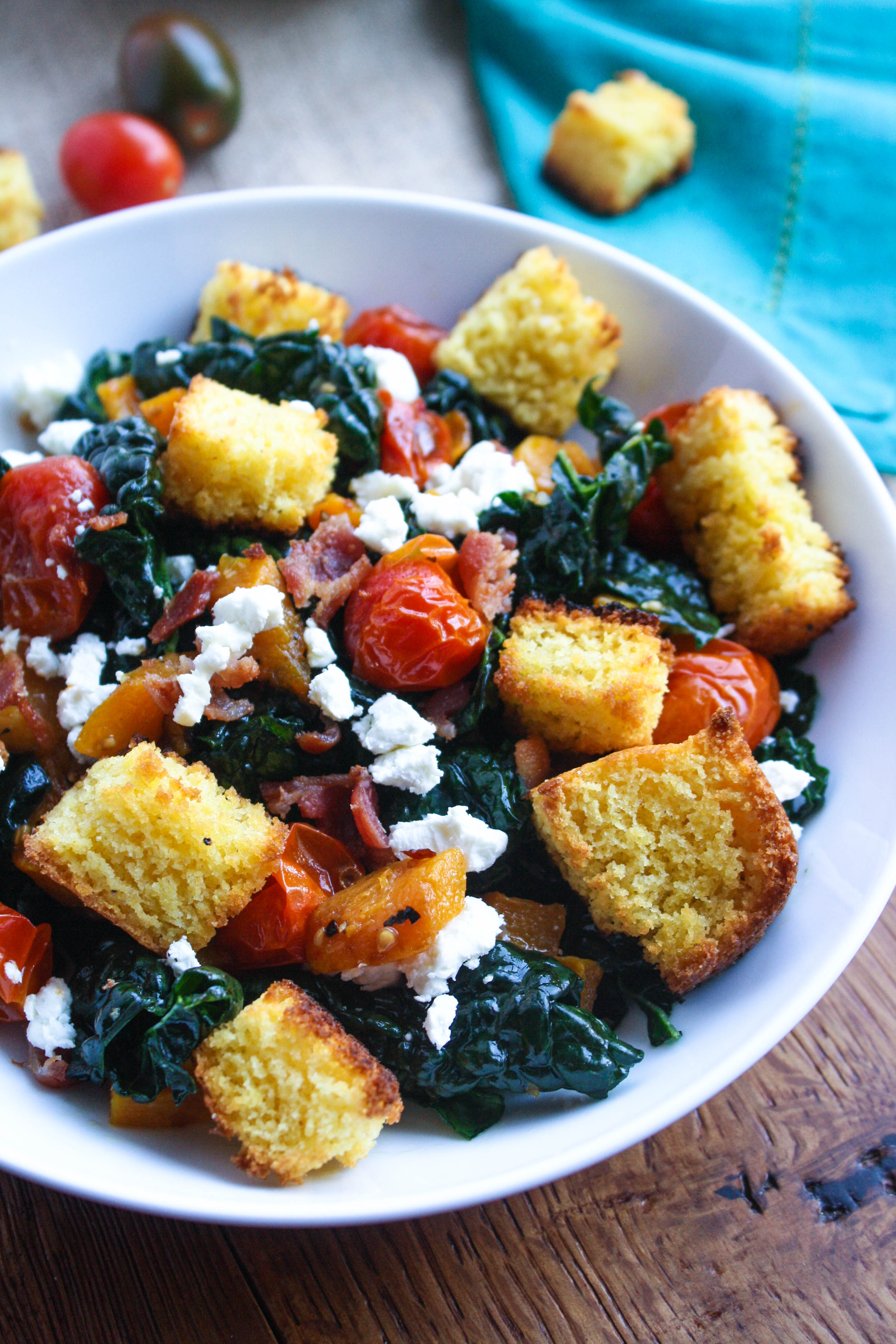 Kale and Cornbread Crouton Salad is a welcome dish the day after Thanksgiving. Use some leftovers to make the cornbread croutons for this wonderful kale salad!