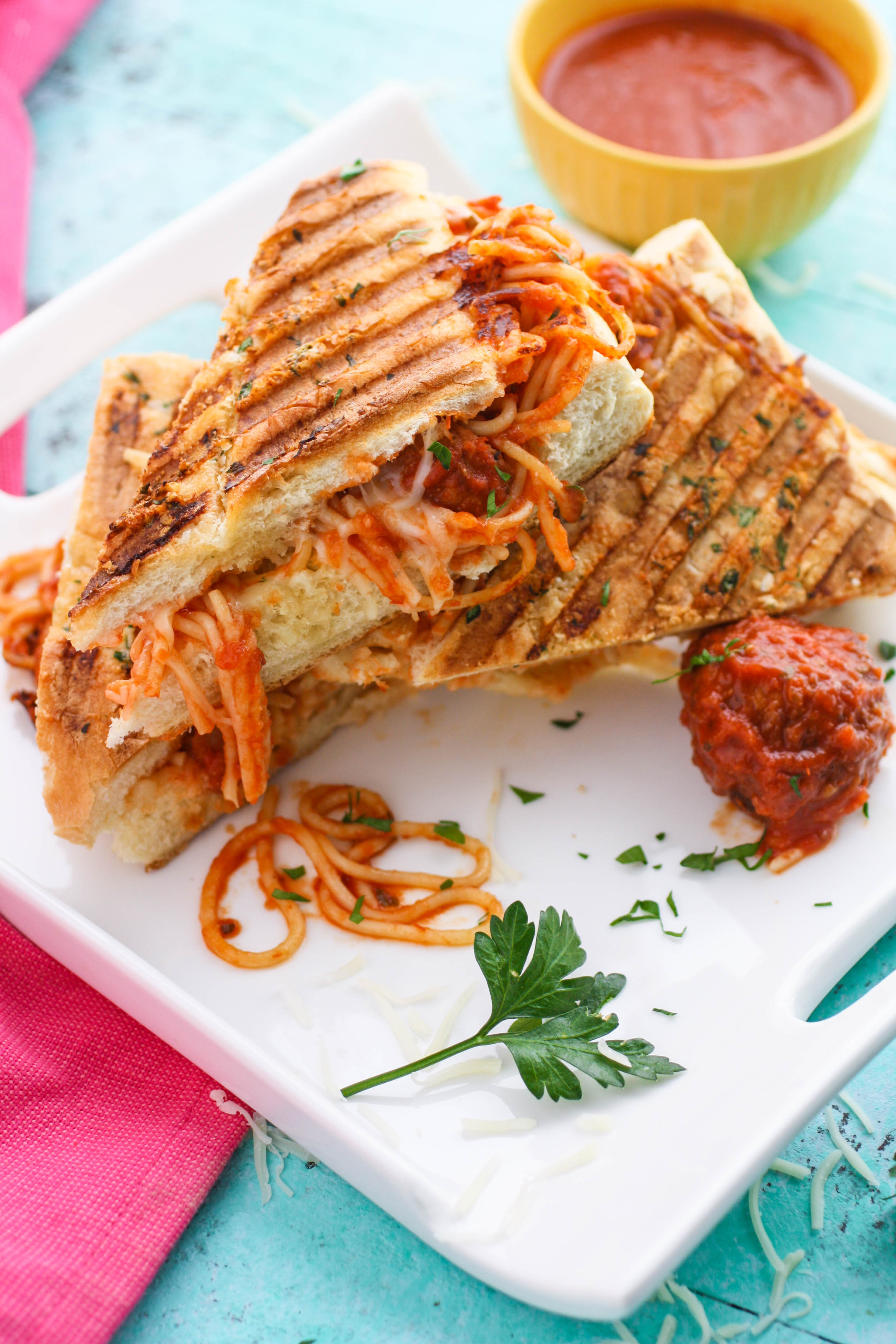 Leftover Spaghetti & Meatball Panini is a fun meal to use up last night's dinner! You'll love this dish that is so fun to serve!