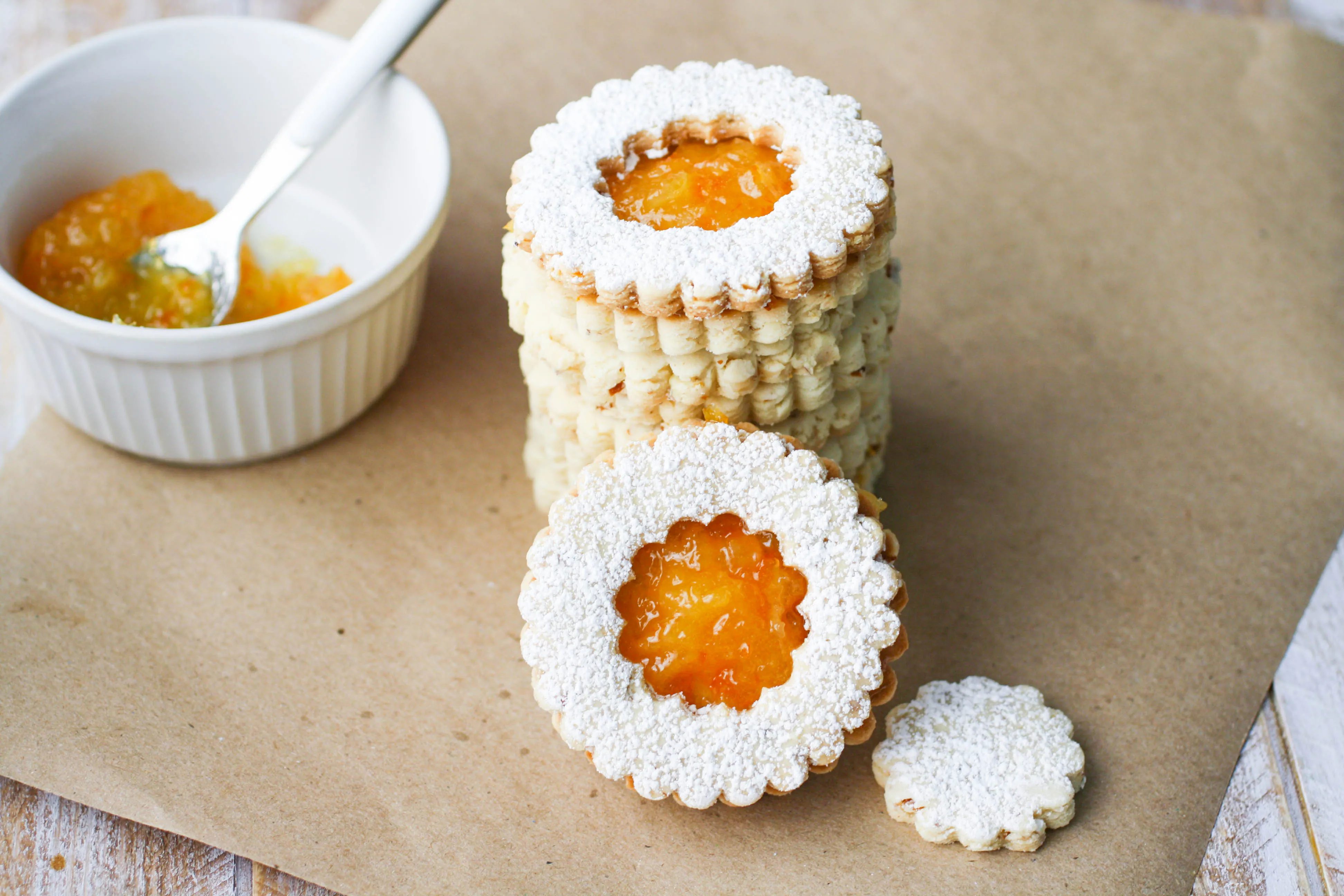Linzer Cookies with Homemade Orange Marmalade are a lovely cookie to serve during the holiday season. These linzer cookies are pretty, and easy to make, too.