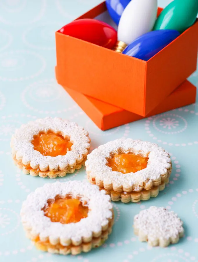Linzer Cookies with Homemade Orange Marmalade are the perfect holiday cookies! You'll love these Linzer cookies with homemade orange marmalade -- they're delicious and pretty!