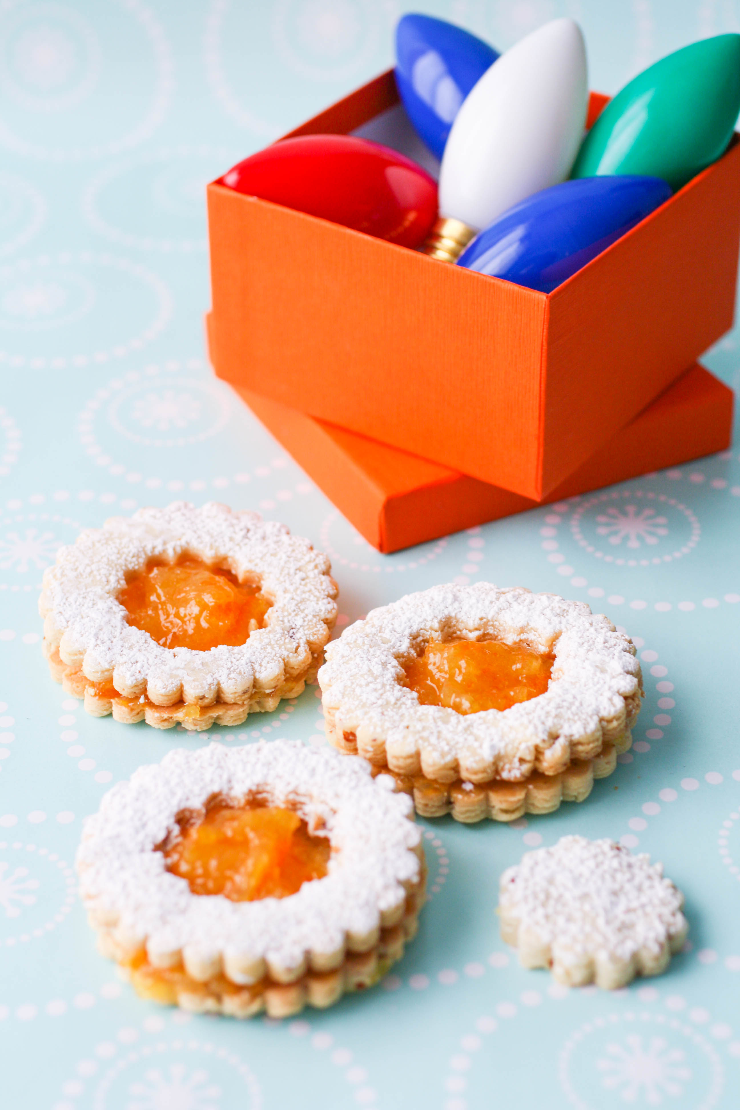 Linzer Cookies with Homemade Orange Marmalade are the perfect holiday cookies! You'll love these Linzer cookies with homemade orange marmalade -- they're delicious and pretty!