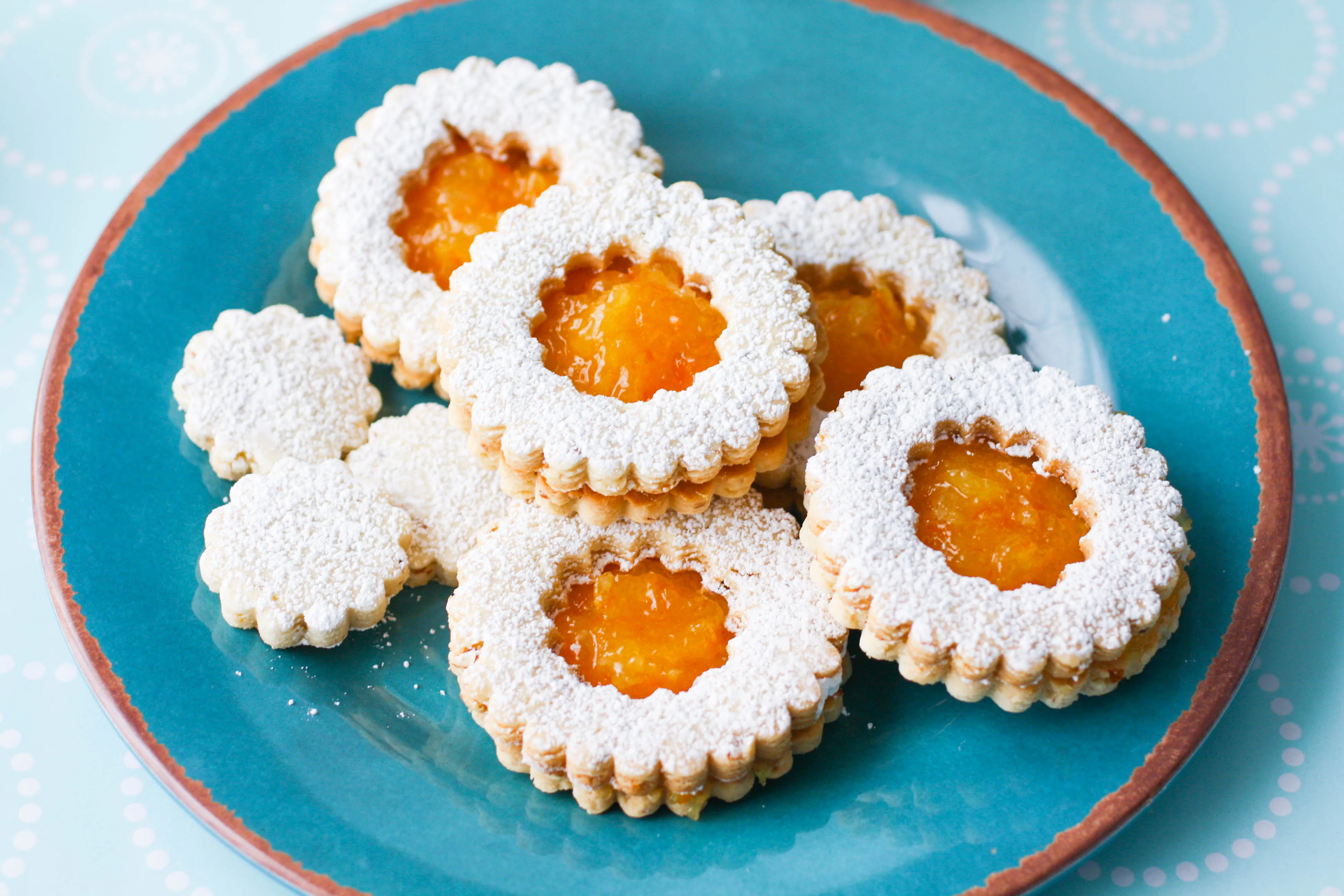 Linzer Cookies with Homemade Orange Marmalade are quite a treat for the season. You'll enjoy making and eating these lovely linzer cookies!