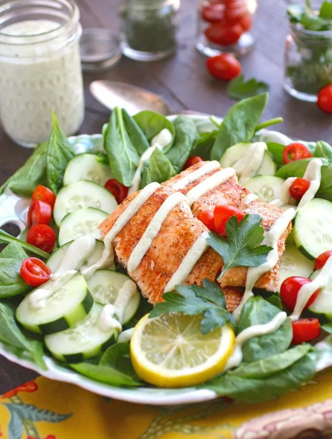 You'll love this Spinach & Salmon Salad with Creamy Dairy-Free Herbed Dressing -- it's perfect for the summer months!