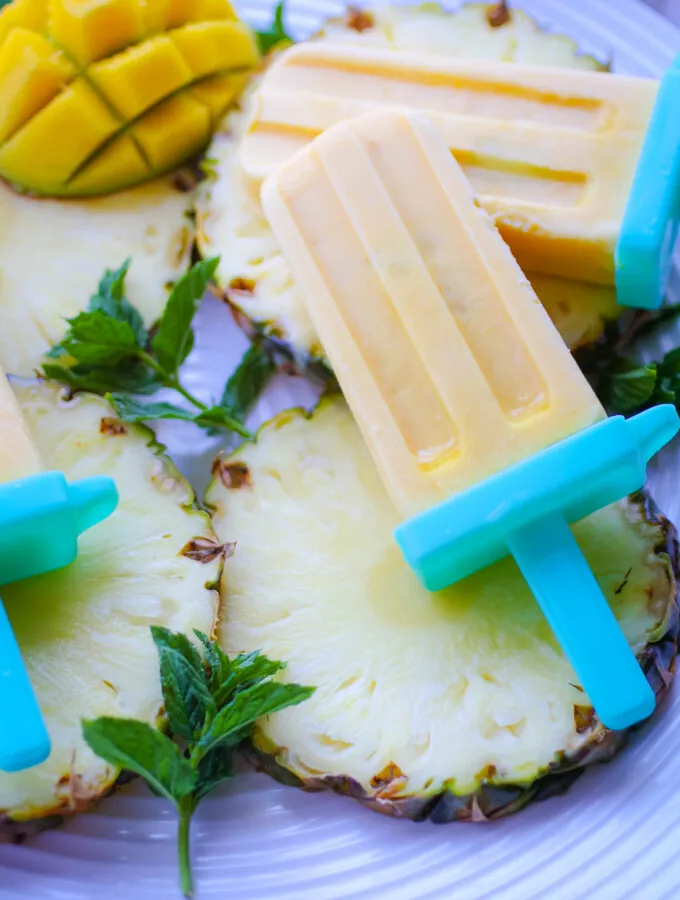 Mango-Pineapple Creamsicles are frosty and tasty for an ideal summer cool-down treat!