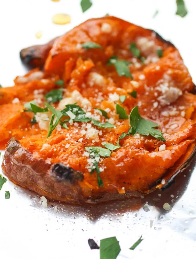 Maple Chipotle Parmesan Smashed Sweet Potatoes is an easy-to-make side dish perfect anytime. These sweet potatoes are lovely combined with maple syrup, chipotle chili powder and Parmesan!