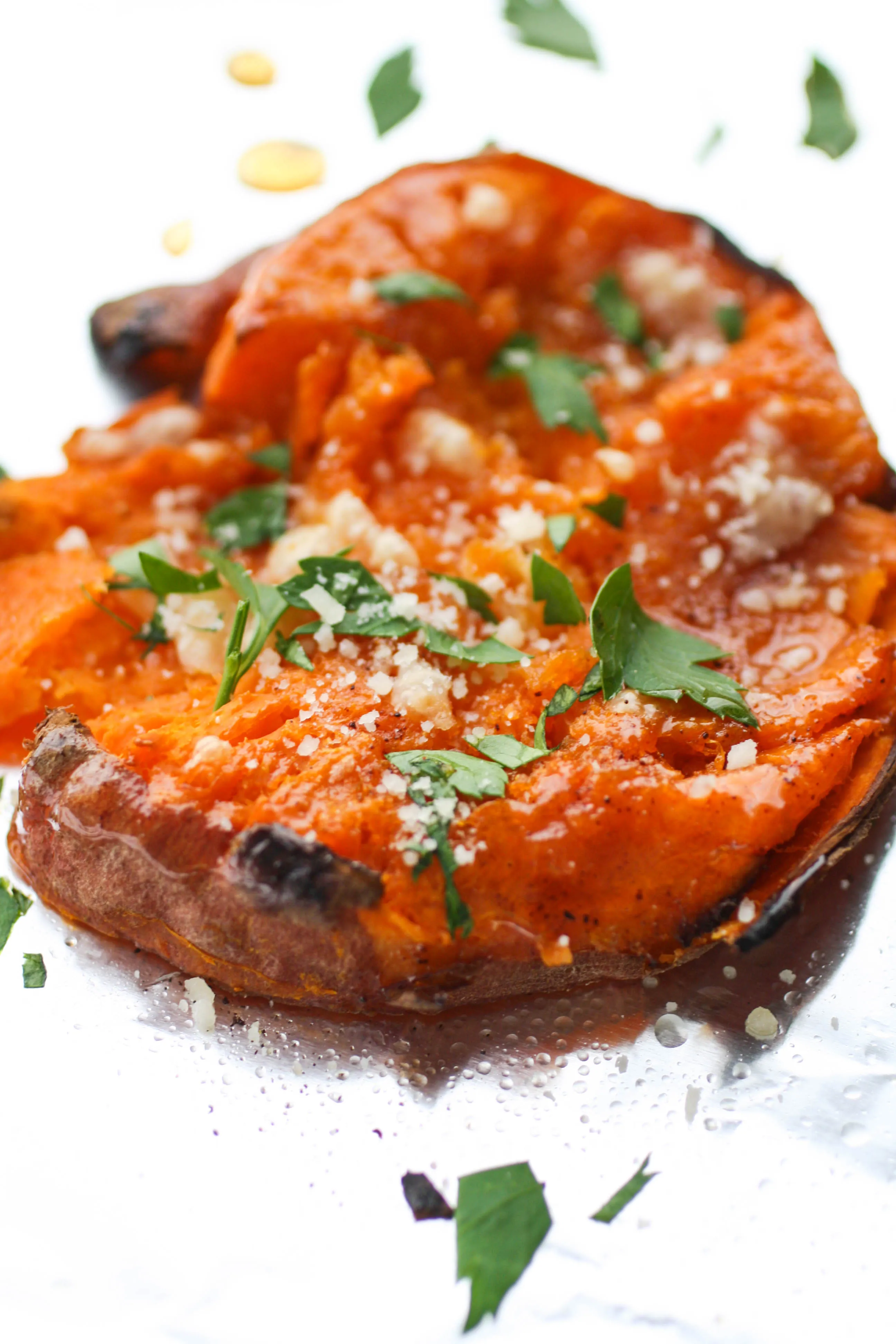 Maple Chipotle Parmesan Smashed Sweet Potatoes is an easy-to-make side dish perfect anytime. These sweet potatoes are lovely combined with maple syrup, chipotle chili powder and Parmesan!