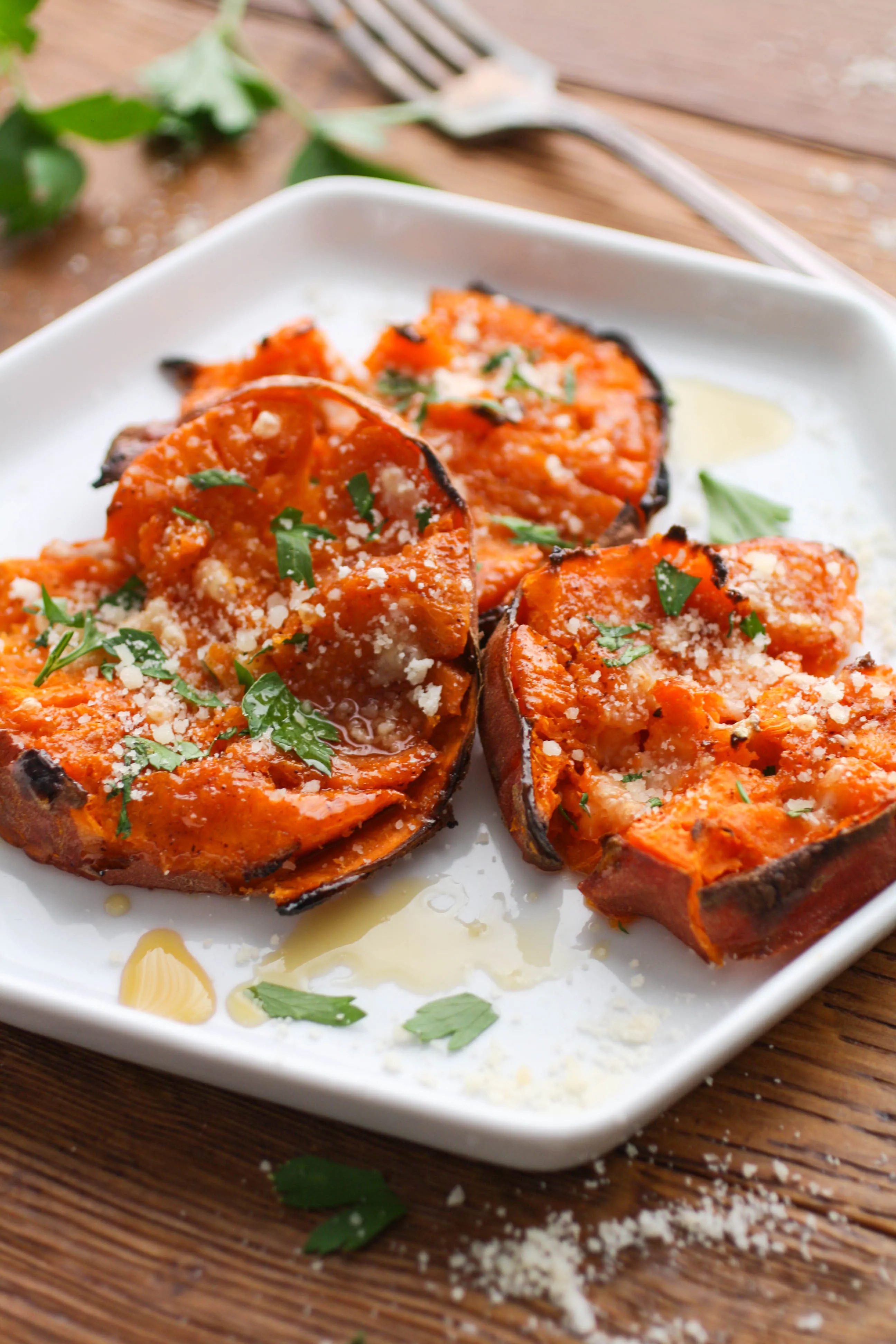 Maple Chipotle Parmesan Smashed Sweet Potatoes are a delicious side dish. These sweet potatoes are super easy to make!