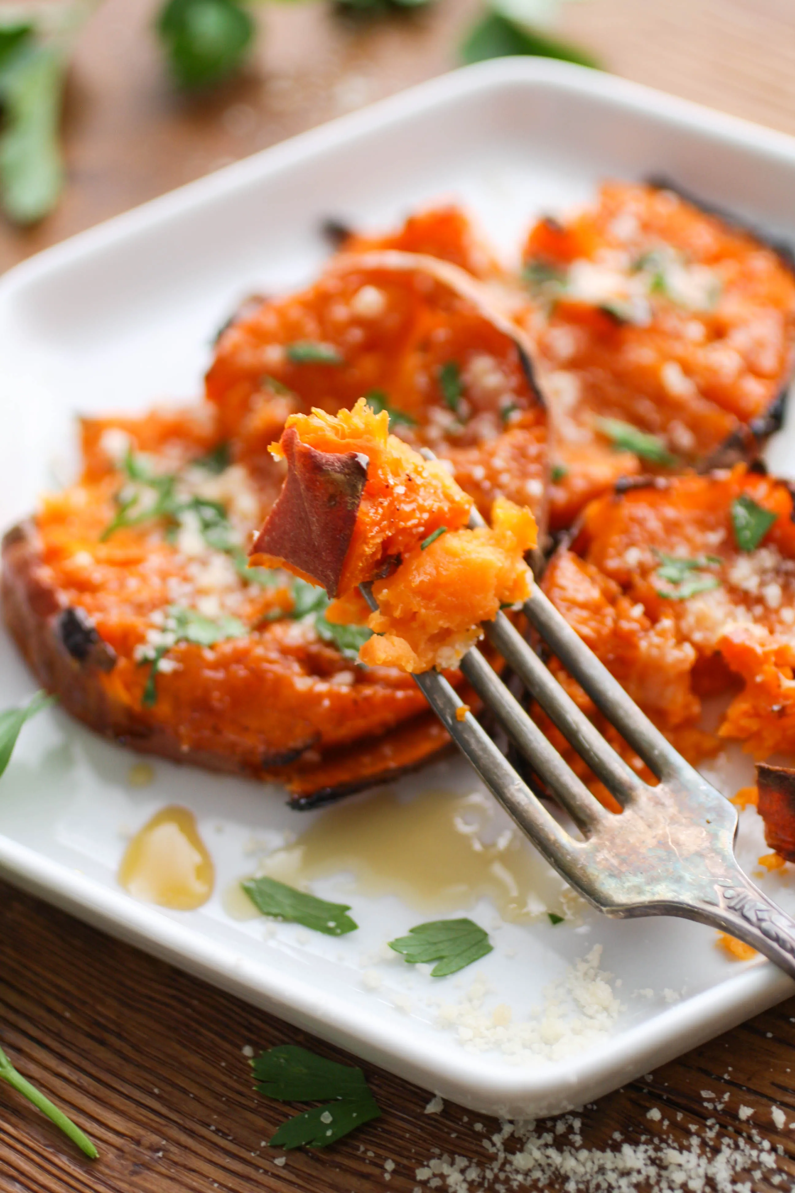 Maple Chipotle Parmesan Smashed Sweet Potatoes are so delicious, and a perfect side dish for any meal. You'll love all the flavor in these potatoes!