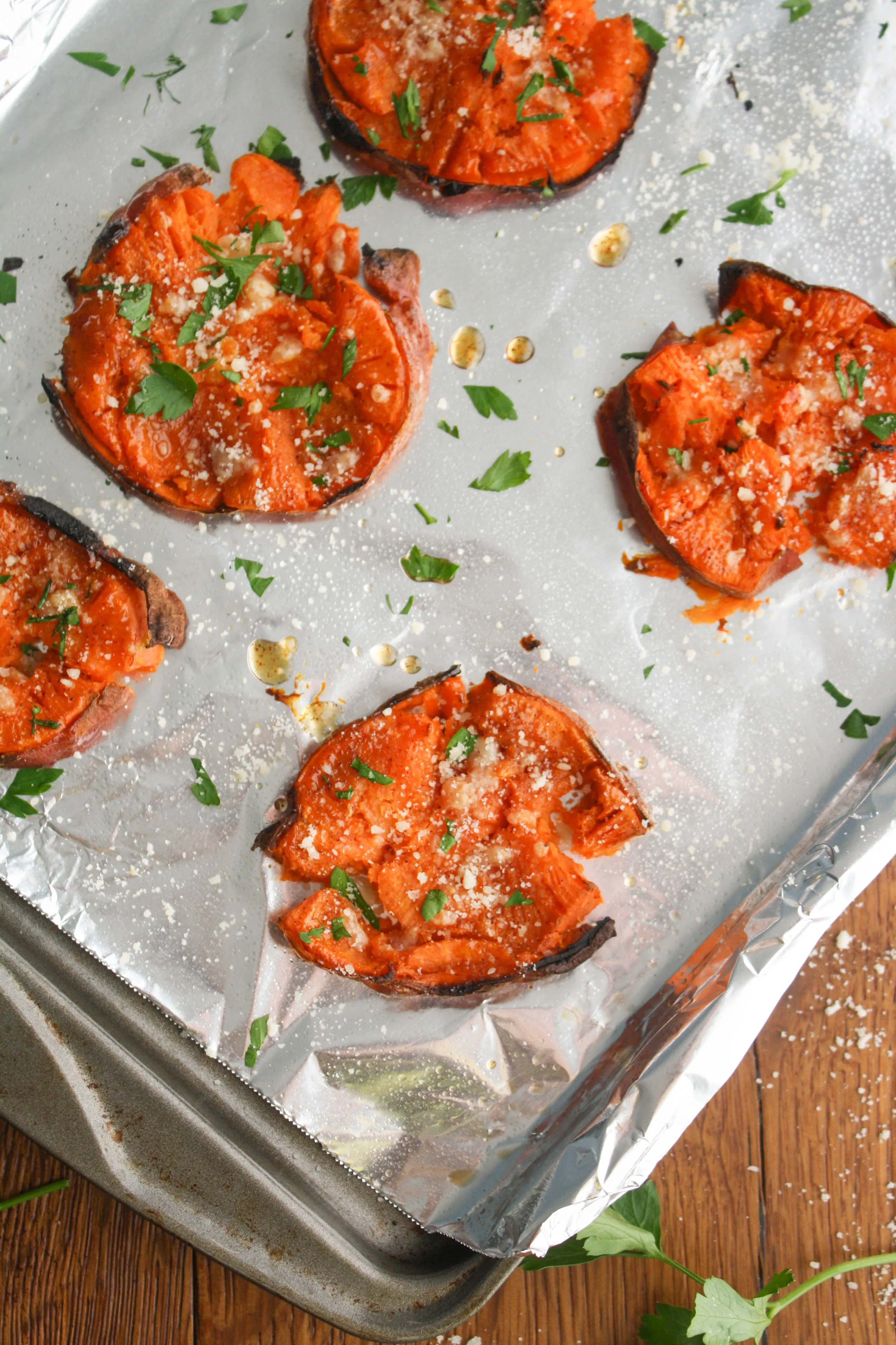 Maple Chipotle Parmesan Smashed Sweet Potatoes are easy to make and perfect with any meal. You'll love the flavors of these potatoes!