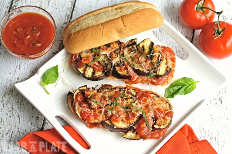 Plated-piled-grilled-eggplant-sandwiches-marinara-sauce
