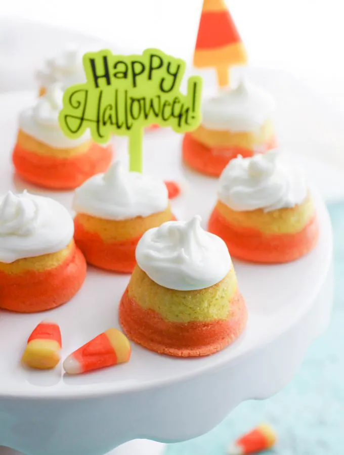 Mini “Candy Corn” Cupcakes with Buttercream Frosting is a tasty Halloween dessert. You'll love the look and taste of these cupcakes!