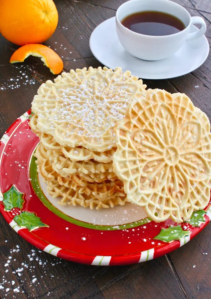 Pile the cookies high! Orange-Amaretto Pizzelle Cookies are fabulous for the season!