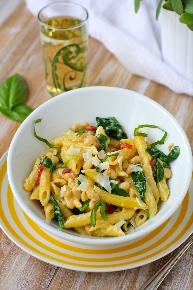 UncommonGoods Floral Wine Glass with a bowl of Creamy Pasta with White Beans and Spinach