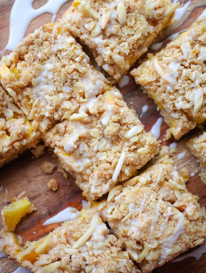 Peach Crumble Squares with Bourbon Glaze are lovely summertime treats. You'll love these Peach Crumble Squares with Bourbon Glaze for your next dessert idea.