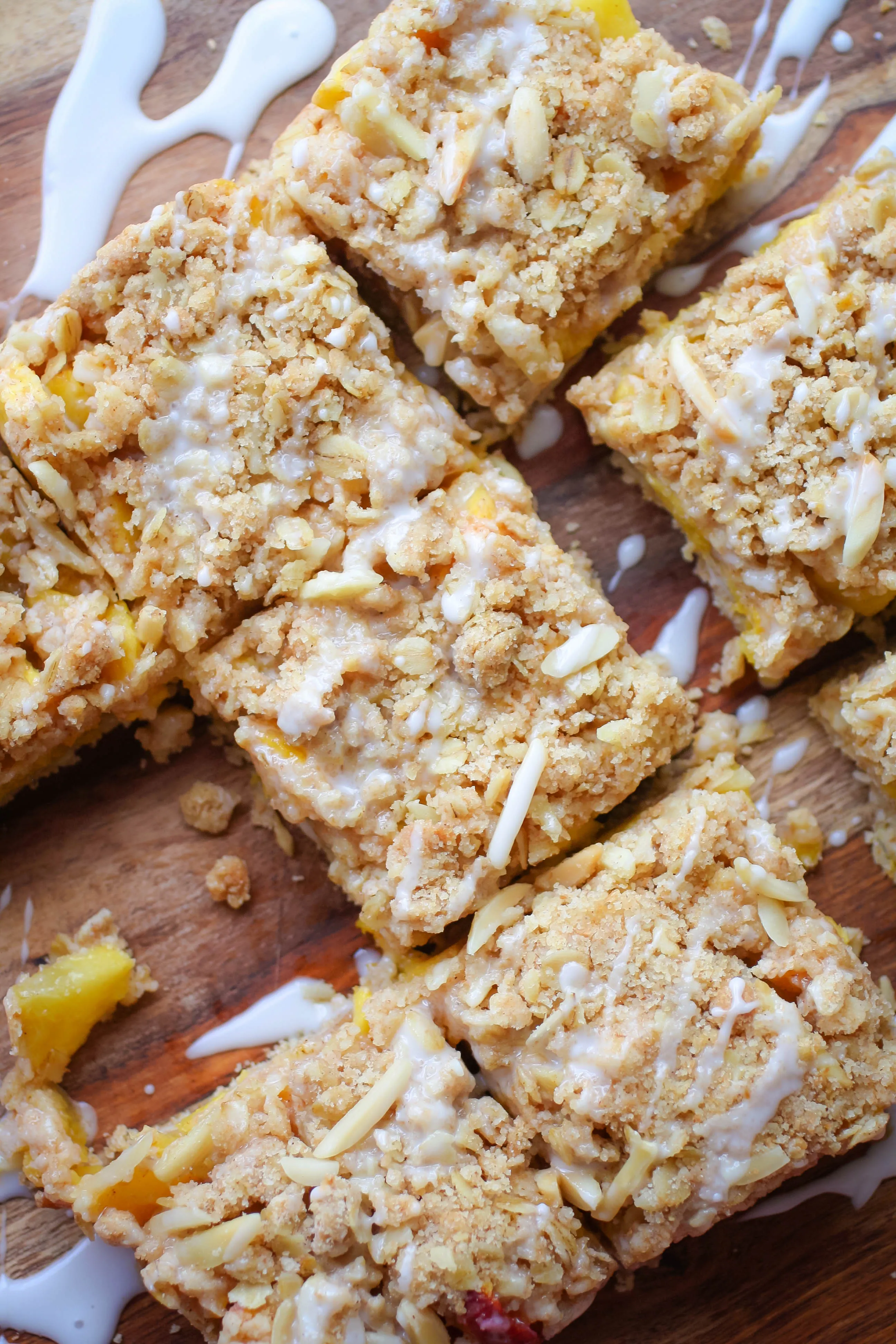 Peach Crumble Squares with Bourbon Glaze are lovely summertime treats. You'll love these Peach Crumble Squares with Bourbon Glaze for your next dessert idea.