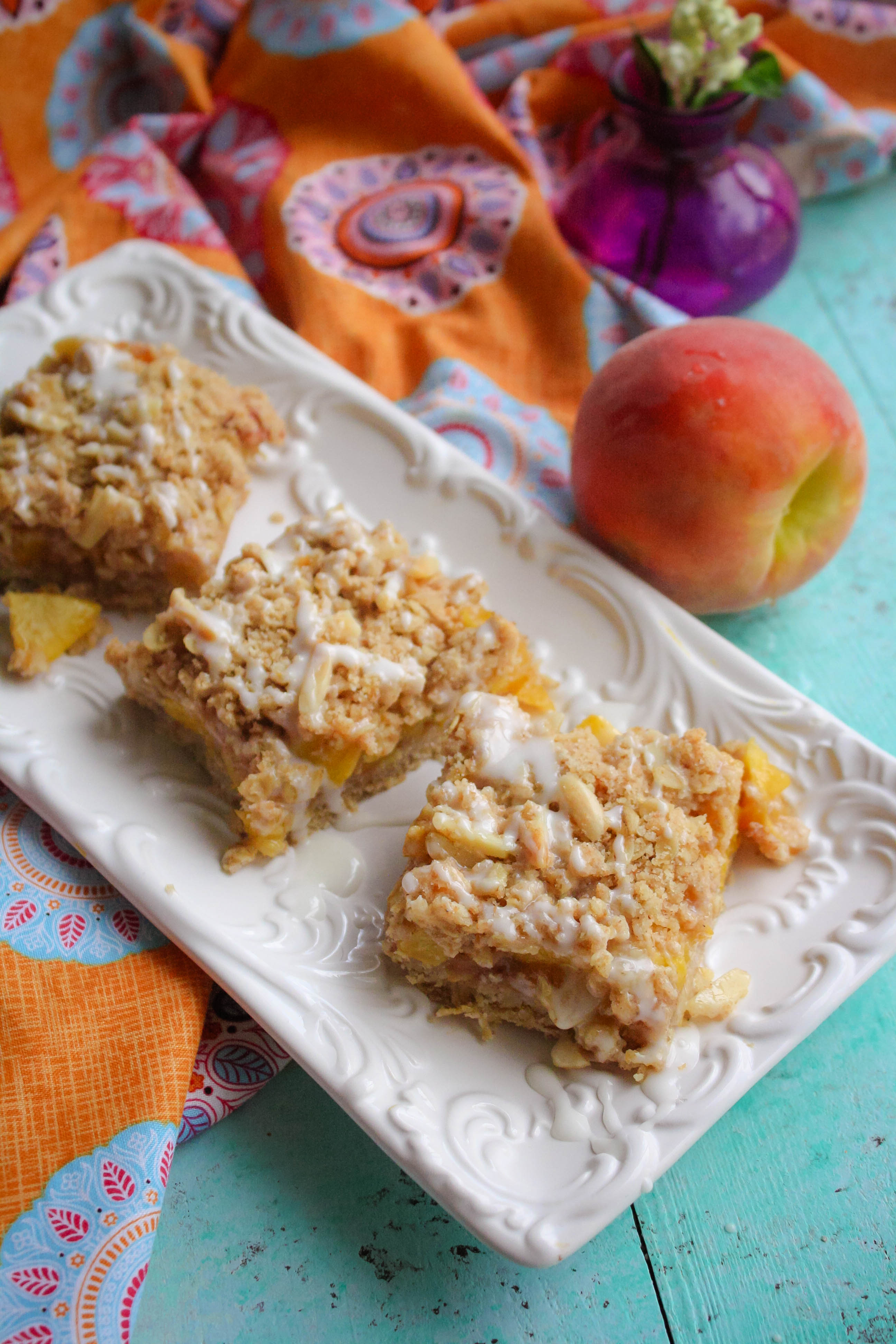 Peach Crumble Squares with Bourbon Glaze make a luscious sweet treat this season. Peach Crumble Squares with Bourbon Glaze are special summertime treats, for sure!