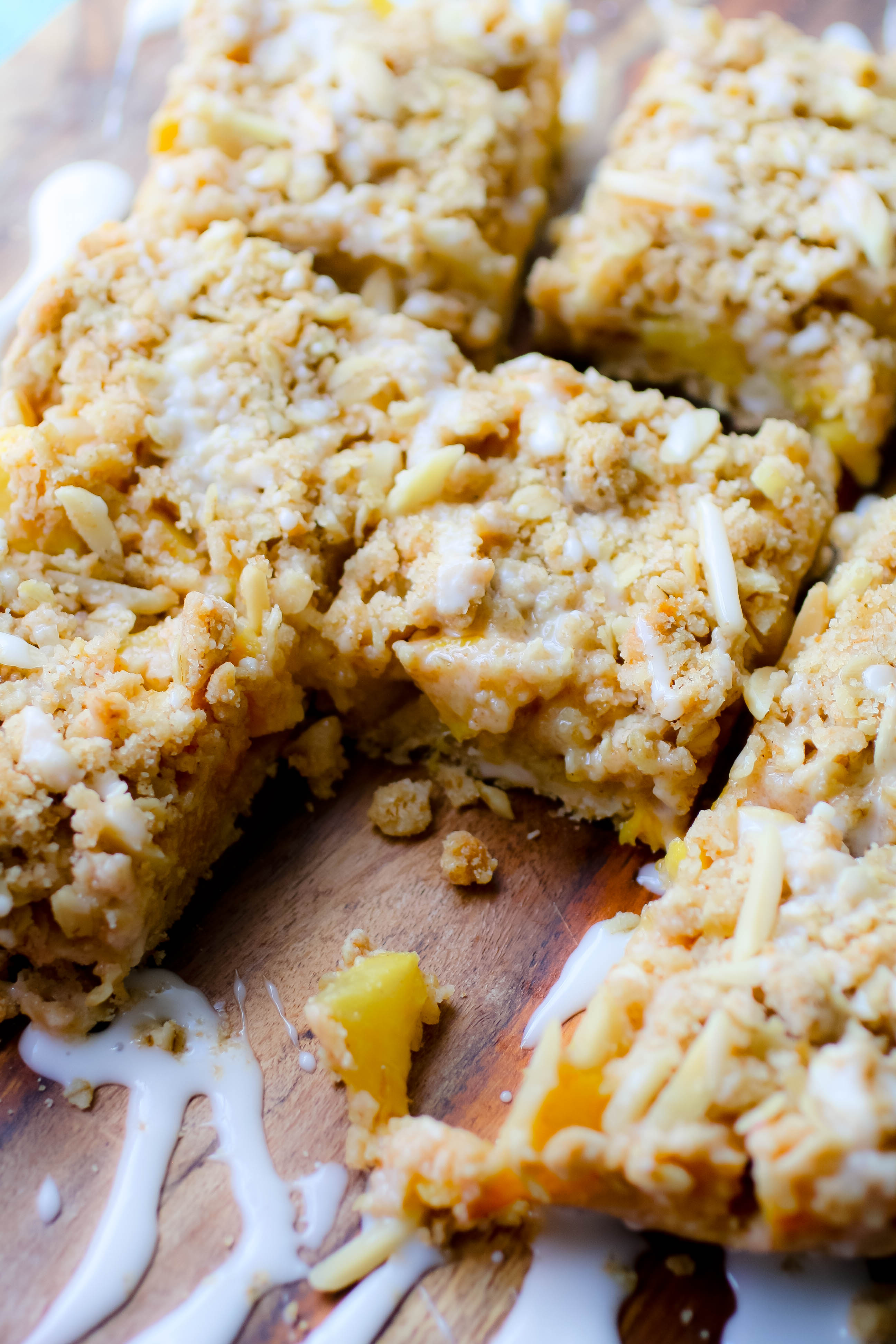Peach Crumble Squares with Bourbon Glaze are the perfect sweet treat for the summer. Use up summer's peaches to make these Peach Crumble Squares with Bourbon Glaze.