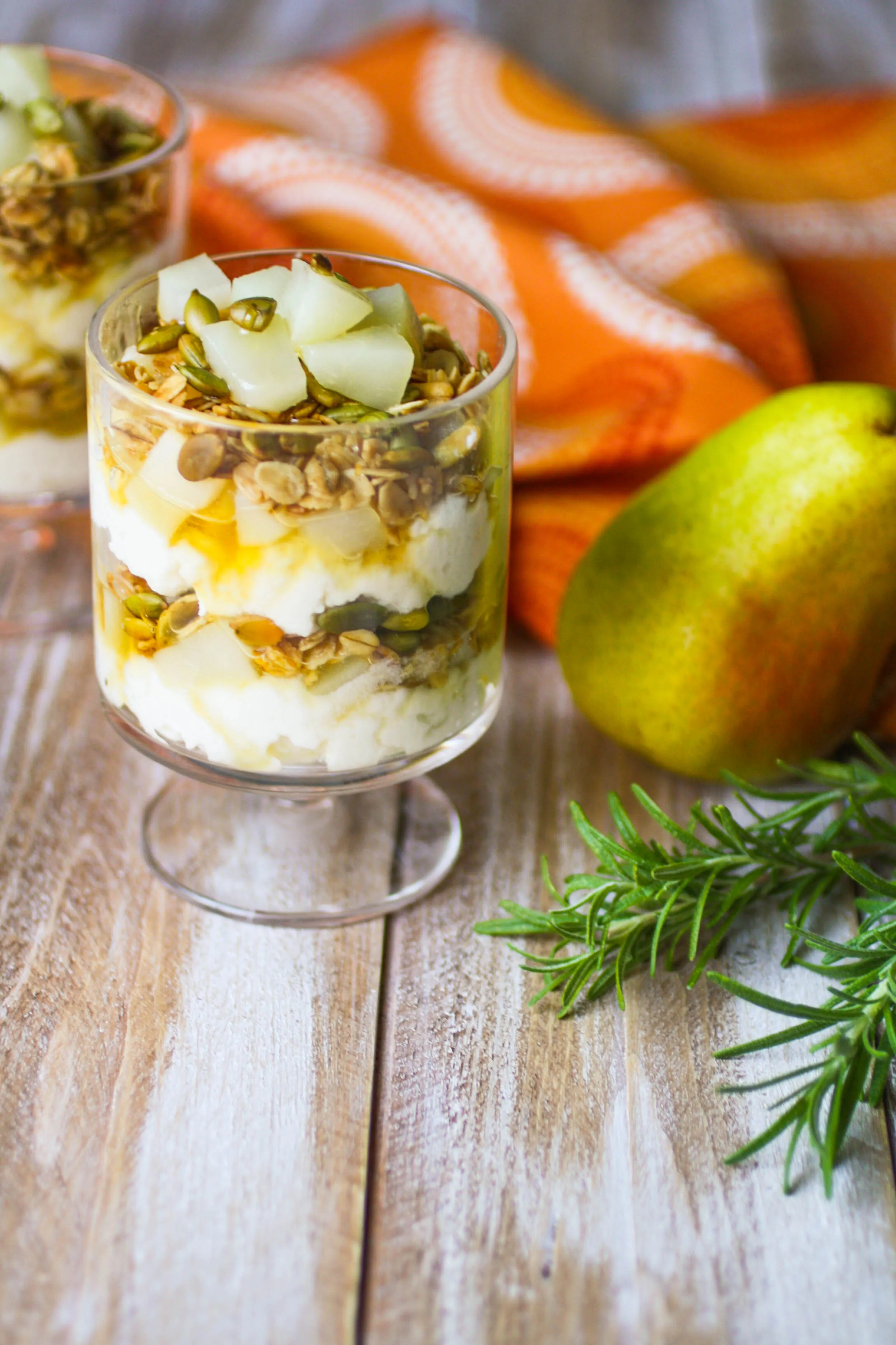 Pear and Ricotta Parfaits with Rosemary-infused Honey is a simple treat you'll enjoy. These pear parfaits are perfect for dessert, or breakfast!
