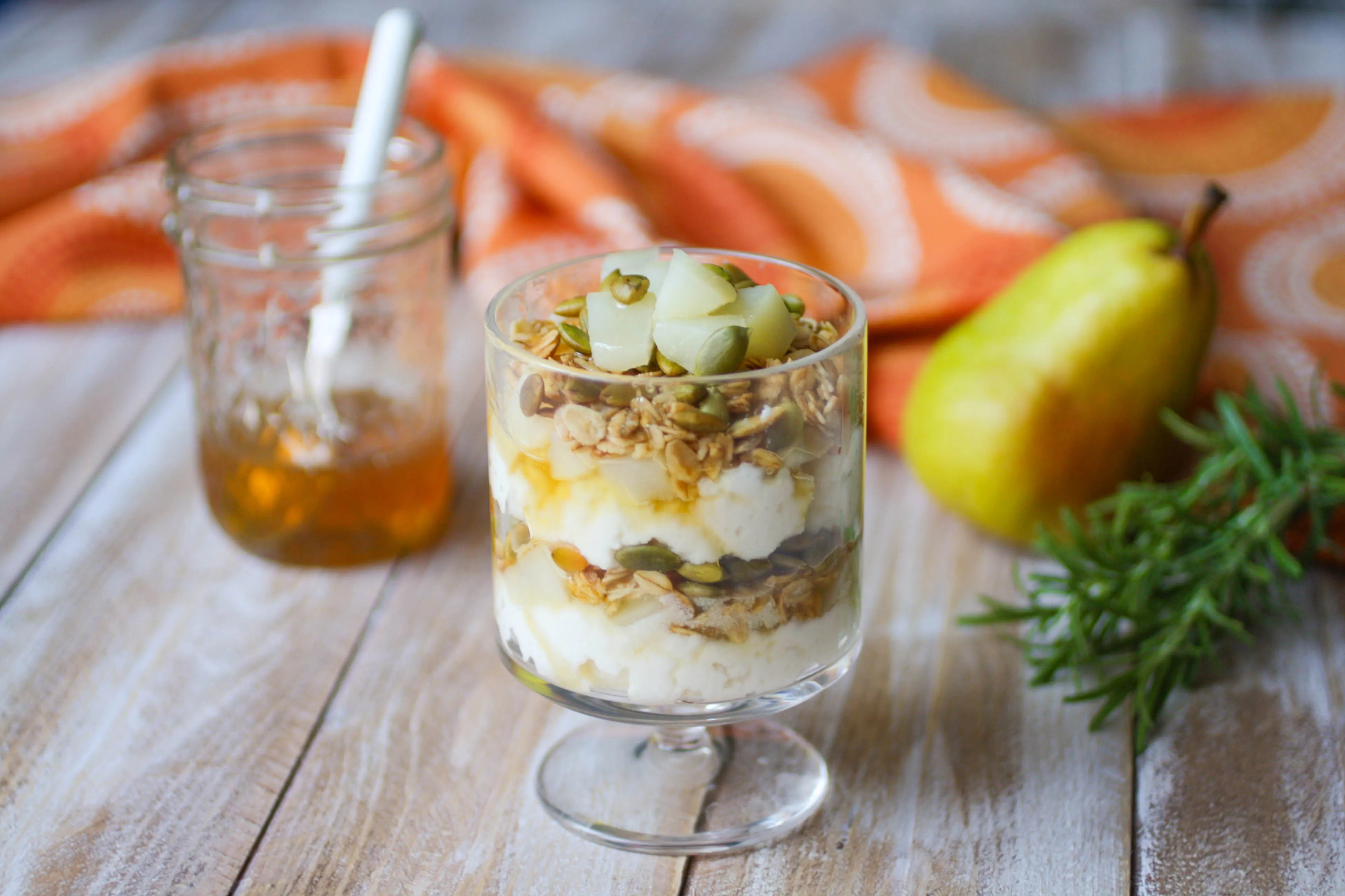 Pear and Ricotta Parfaits with Rosemary-Infused Honey is a treat to enjoy for breakfast or dessert! You'll love these pear parfaits any time of day.