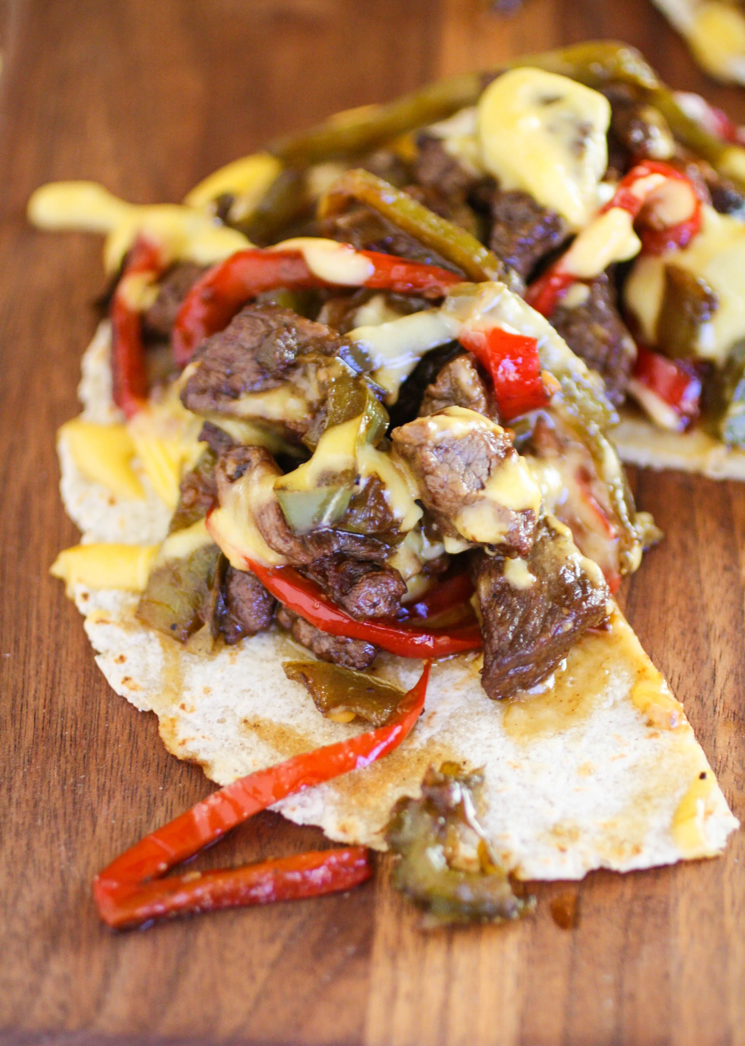 Philly Cheesesteak Tostadas make a fun meal that is filling and flavorful. You'll love these Philly Cheesesteak Tostadas!