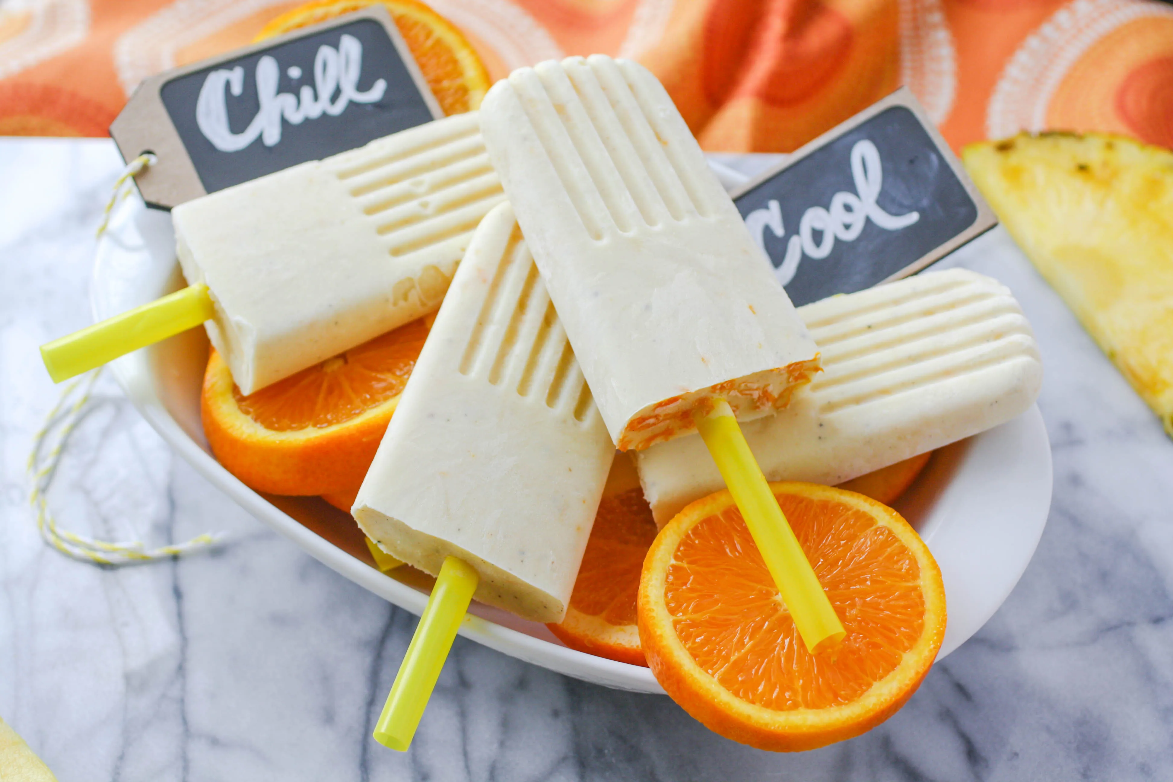 Pineapple-Orange & Cardamom Creamsicles are delicious and a fun way to chill out! Pineapple-Orange & Cardamom Creamsicles are a fuity and fun treat!