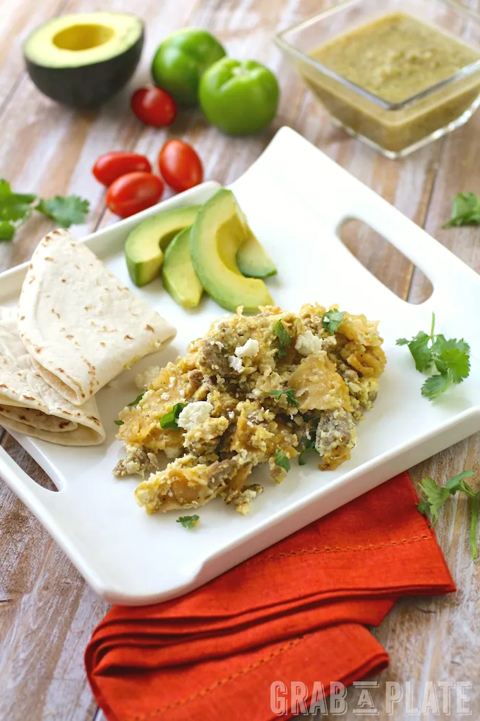 A plate of Skillet Pork Migas with Roasted Tomatillo Salsa is the perfect breakfast dish!
