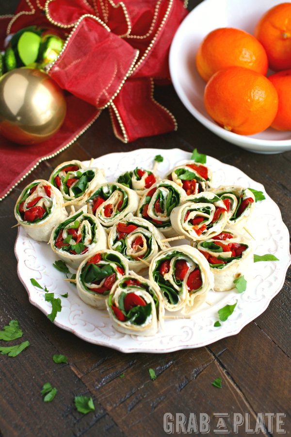 Serve up a platter of Easy Swiss, Spinach, and Red Pepper Pinwheels - so easy for entertaining!