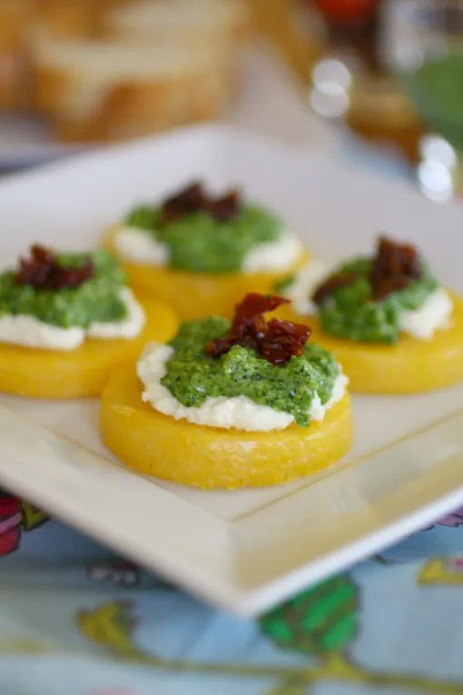 Polenta Cakes with Goat Cheese and Kale Pesto is a fabulous appetizer
