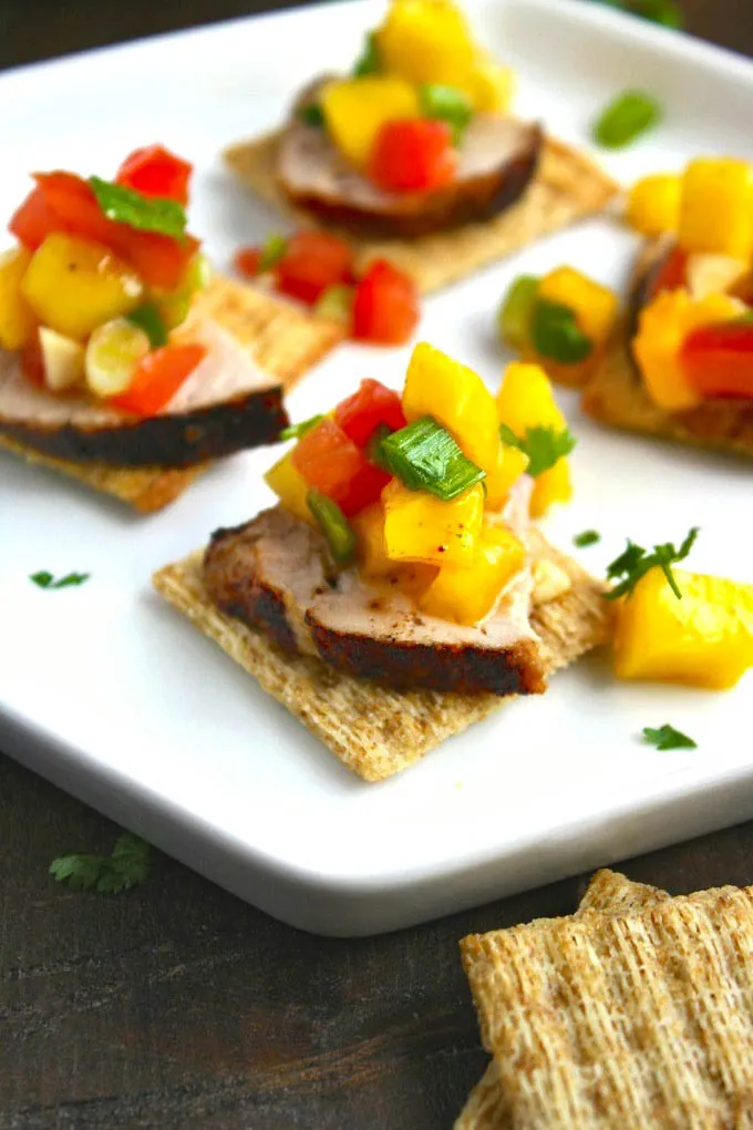 Pork Tenderloin Bites with Mango Salsa is a unique appetizer. Put the chips away and try this dish instead!