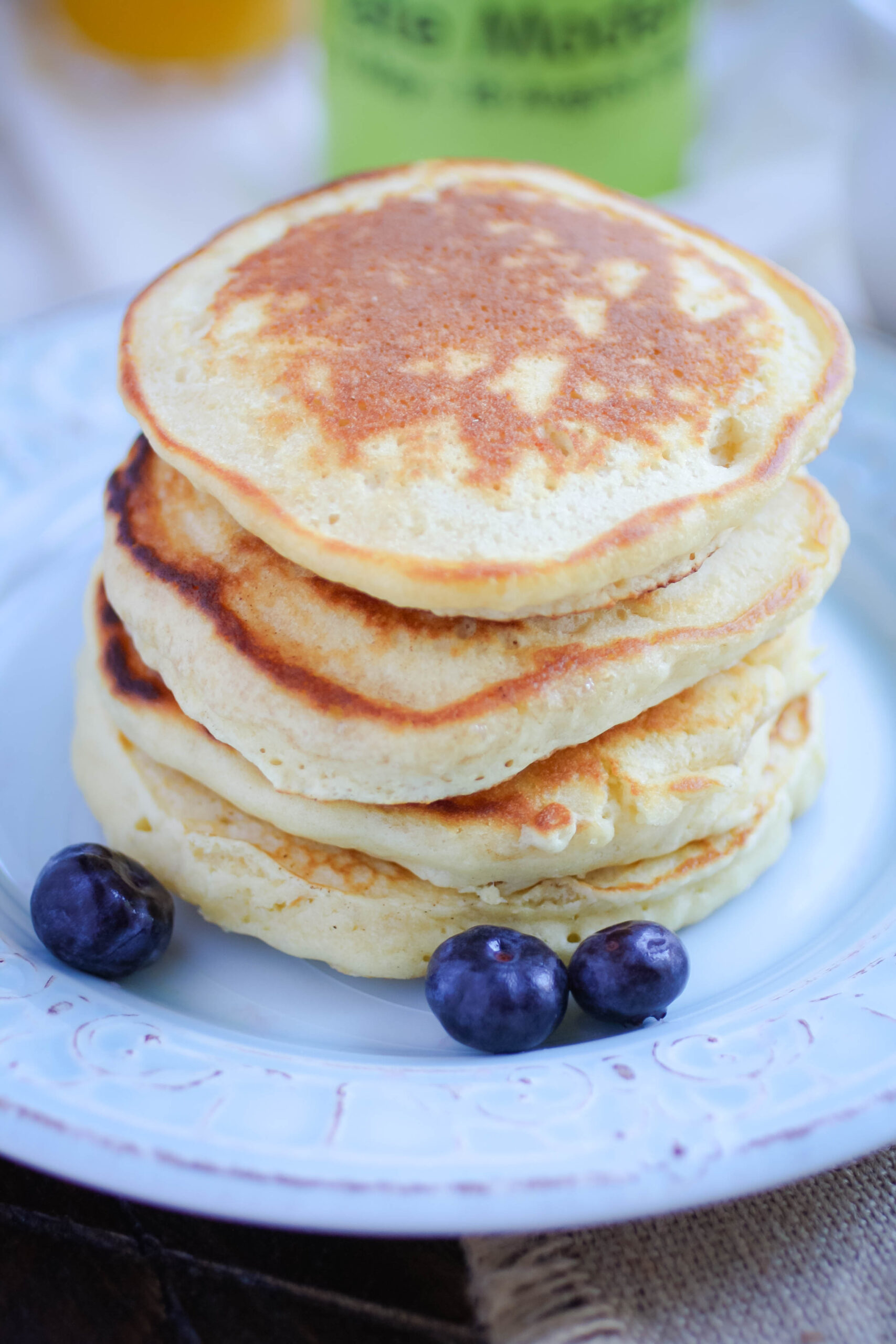 Queen Elizabeth II’s Drop Scones (Scottish Pancakes) are stacked tall on a plate.