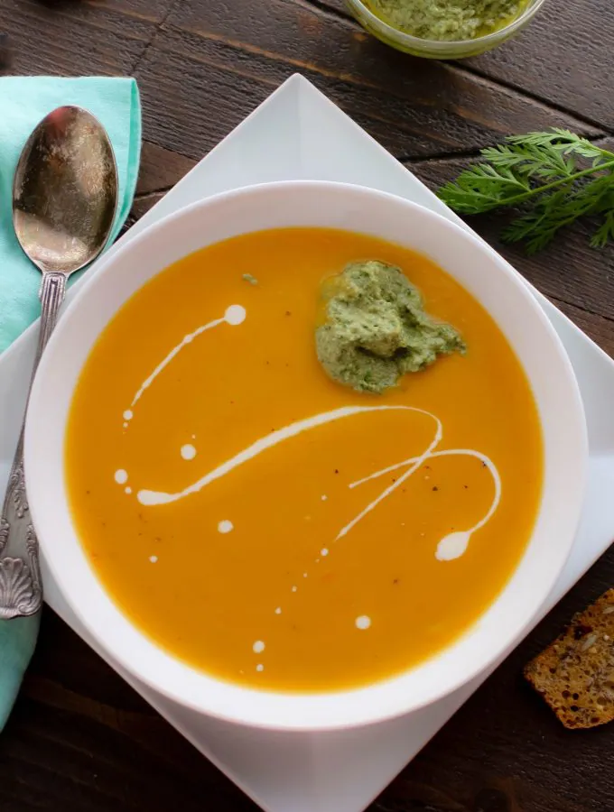 Roasted Carrot and Parsnip Soup with Carrot Greens Pesto is a tasty soup that is so easy to make! You'll love Roasted Carrot and Parsnip Soup with Carrot Greens Pesto for the rich and thick soup it is.