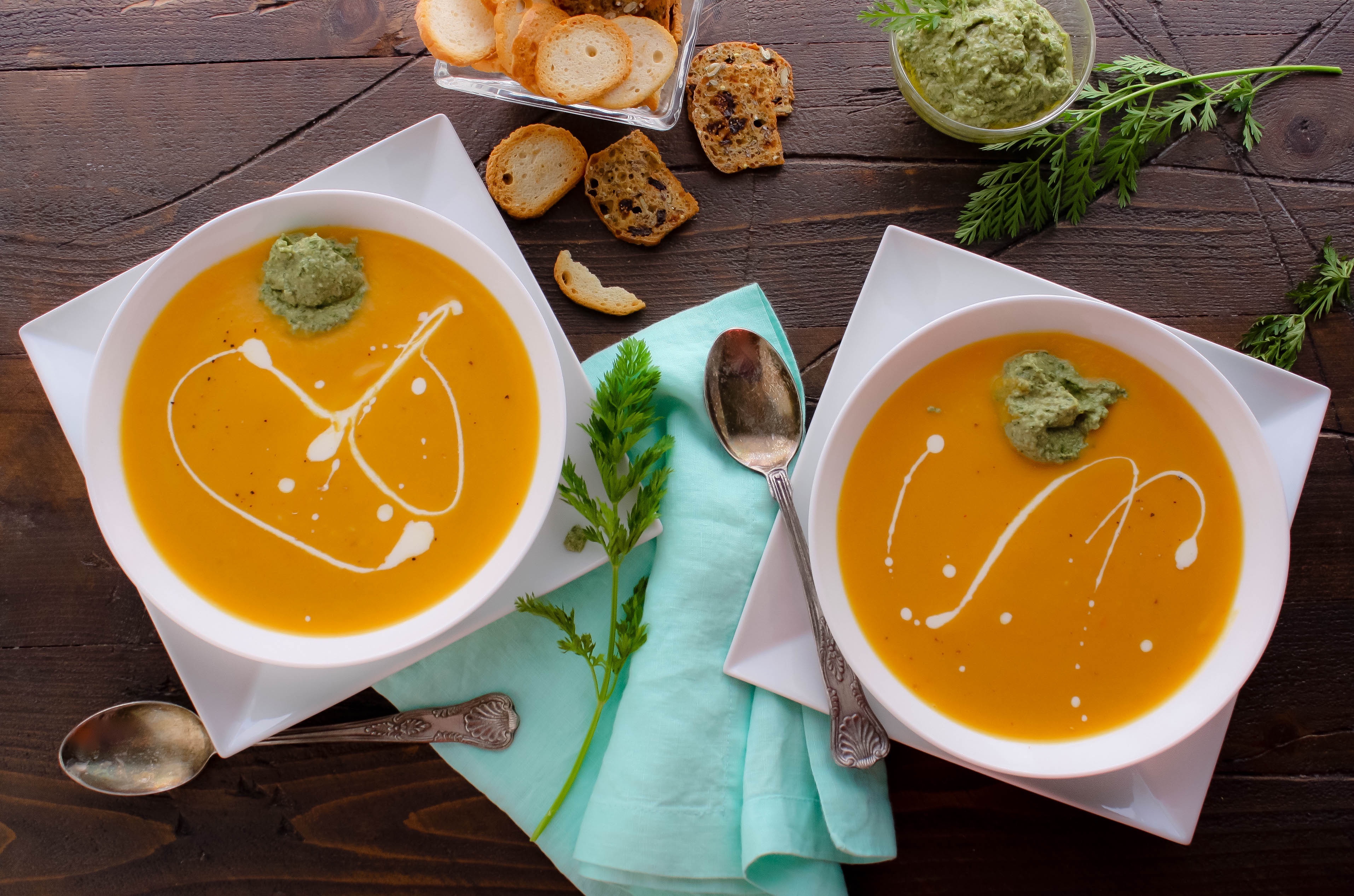 Roasted Carrot and Parsnip Soup with Carrot Greens Pesto is creamy and delicious. You'll love Roasted Carrot and Parsnip Soup with Carrot Greens Pesto for any night of the week.