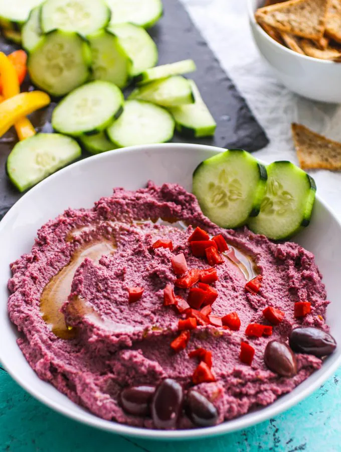 Roasted Garlic and Purple Cauliflower Hummus is a fun dip to serve anytime. Roasted Garlic and Purple Cauliflower Hummus is easy to make, and so colorful for a fun snack!