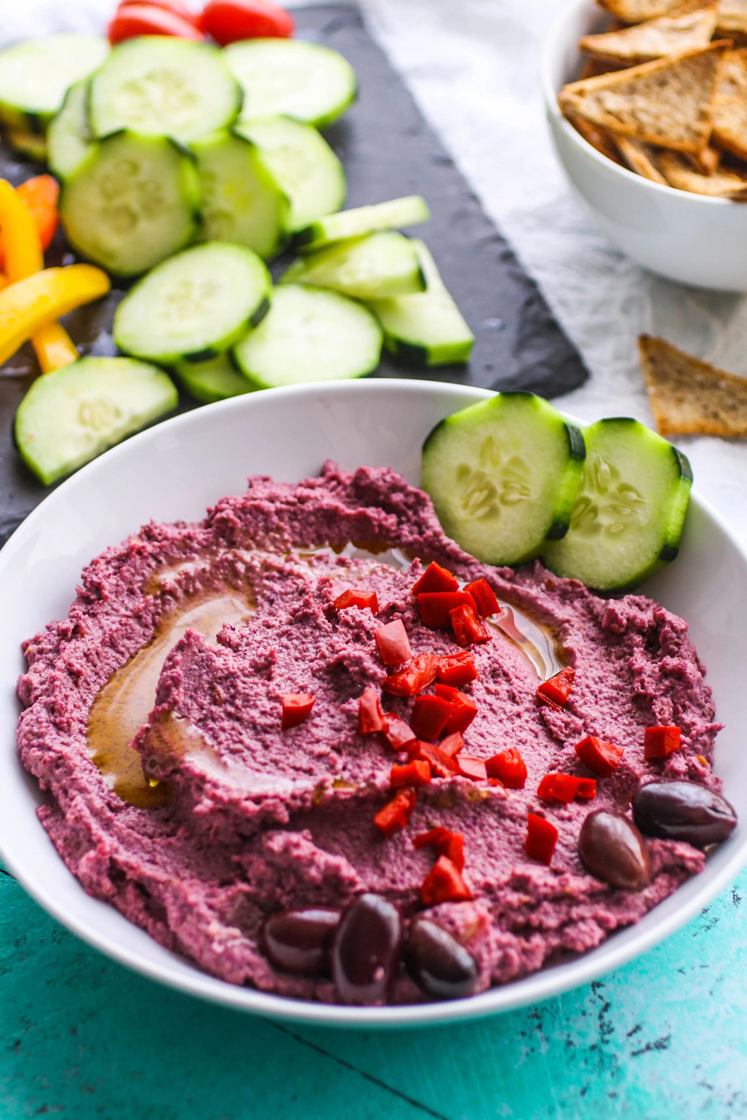  Roasted Garlic and Purple Cauliflower Hummus is a fun dip to serve anytime. Roasted Garlic and Purple Cauliflower Hummus is easy to make, and so colorful for a fun snack!