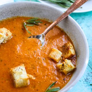 Roasted tomato and vegetable soup with gin drizzle is an ideal soup for the season. Roasted tomato and vegetable soup with gin drizzle is comforting and flavorful for a seasonal dish.