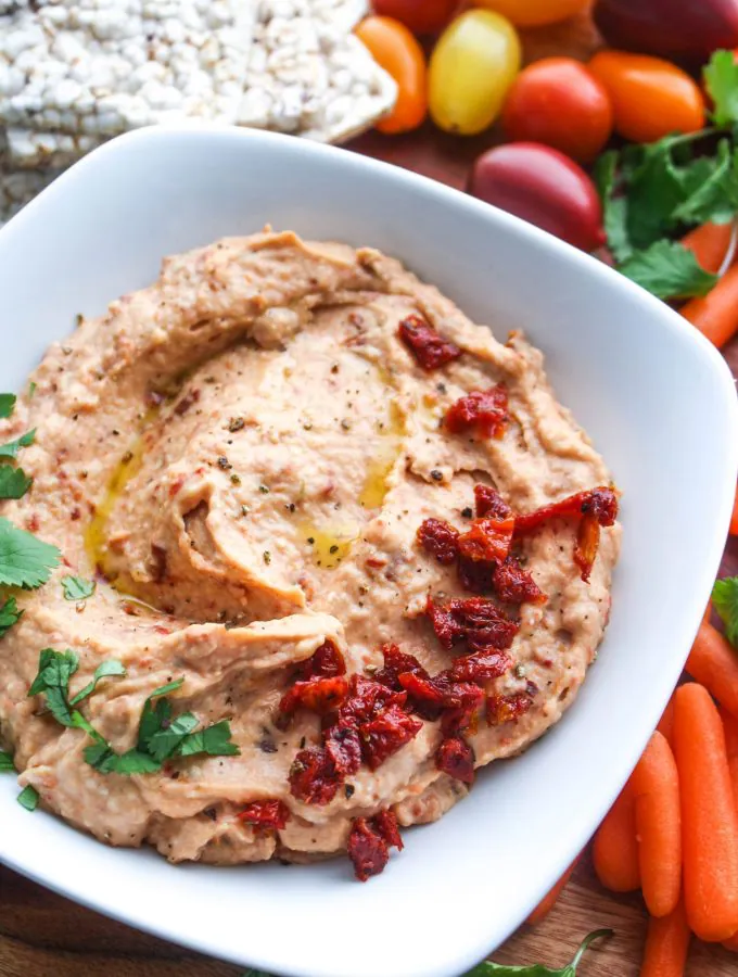 Roasted Garlic and Sun-Dried Tomato Hummus is a fabulous snacking option. You'll love this hummus with roasted garlic and sun-dried tomatoes.