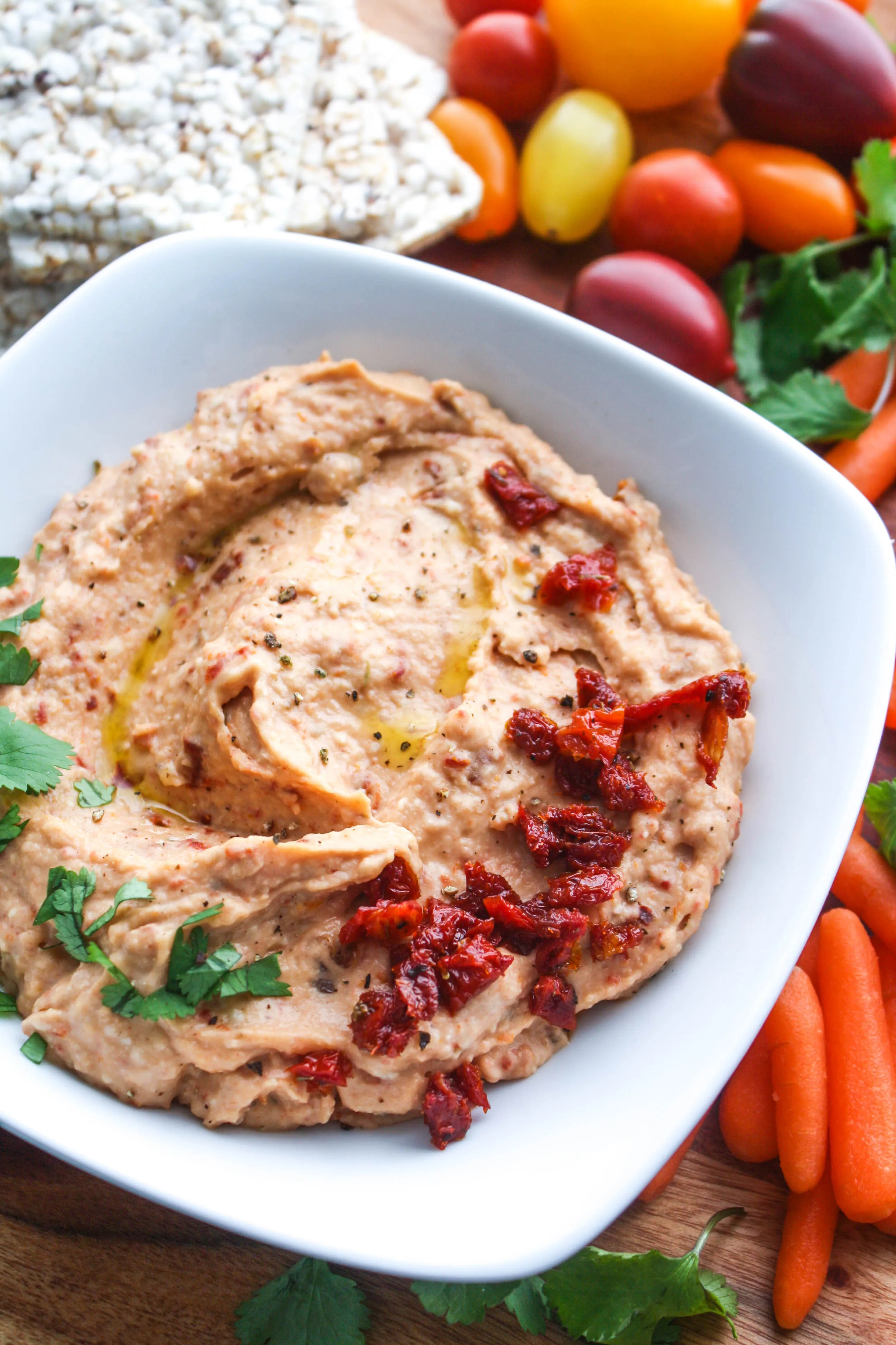 Roasted Garlic and Sun-Dried Tomato Hummus is a fabulous snacking option. You'll love this hummus with roasted garlic and sun-dried tomatoes.