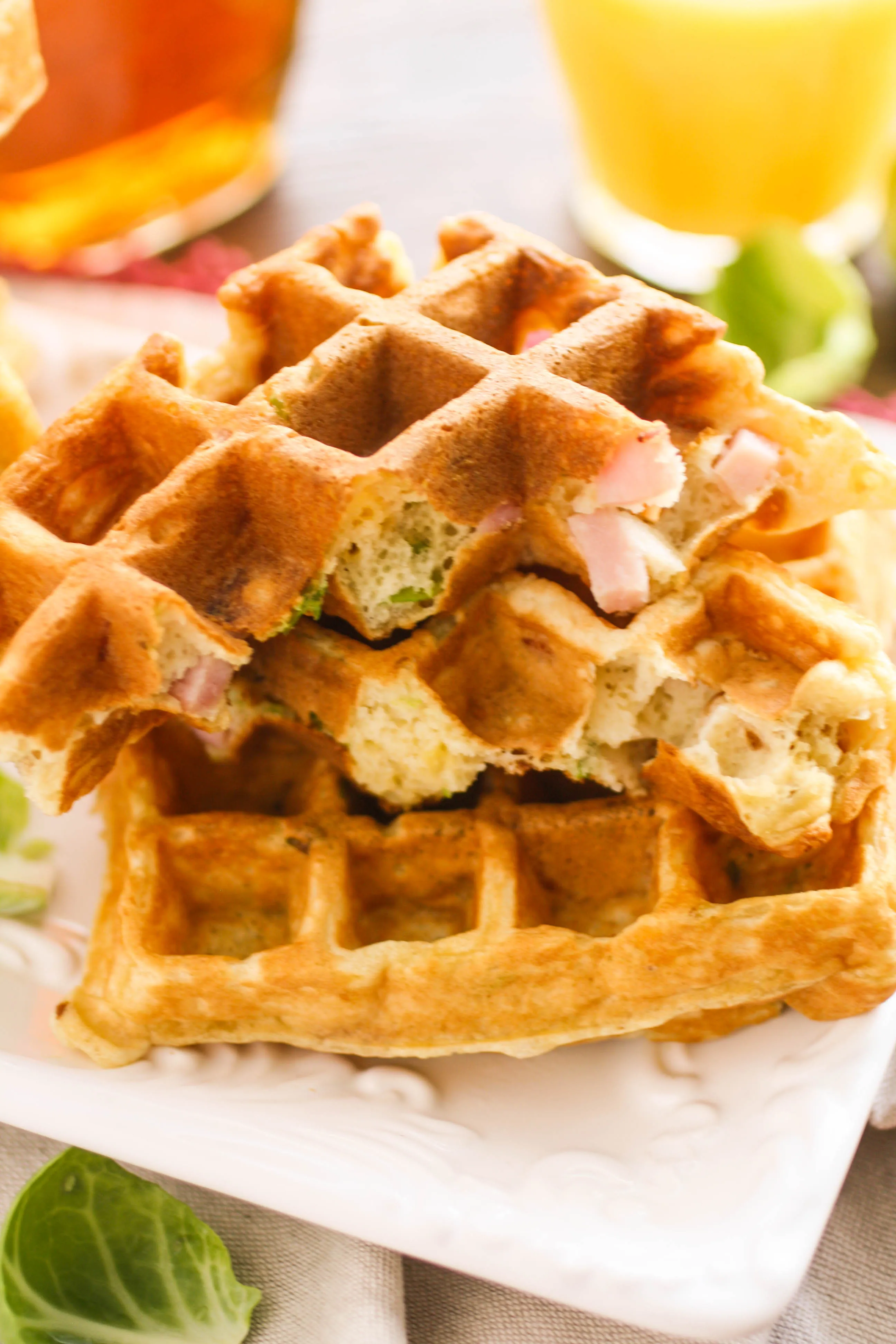 Savory waffles with ham, cheddar, and Brussels sprouts are so flavorful! They're great for any meal! 